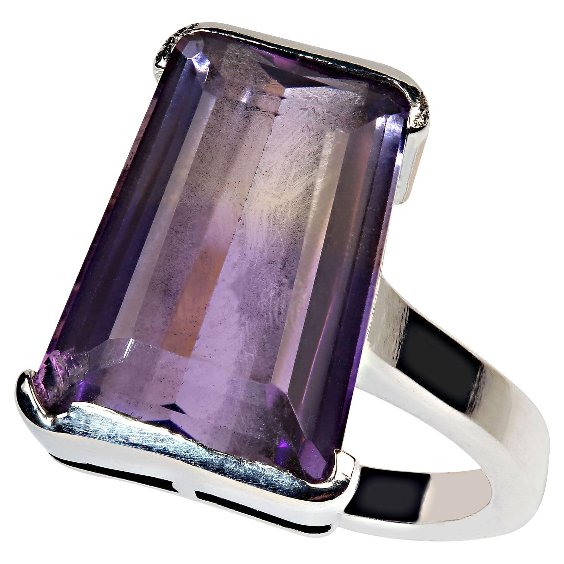 10Ct awesome Ametrine trapezoid Sterling Silver ring.  This interesting Ametrine is set in a half bezel, just the top and bottom, so that the sides are open to lots of light.  The elegant sterling silver band covers both the north and south edges of