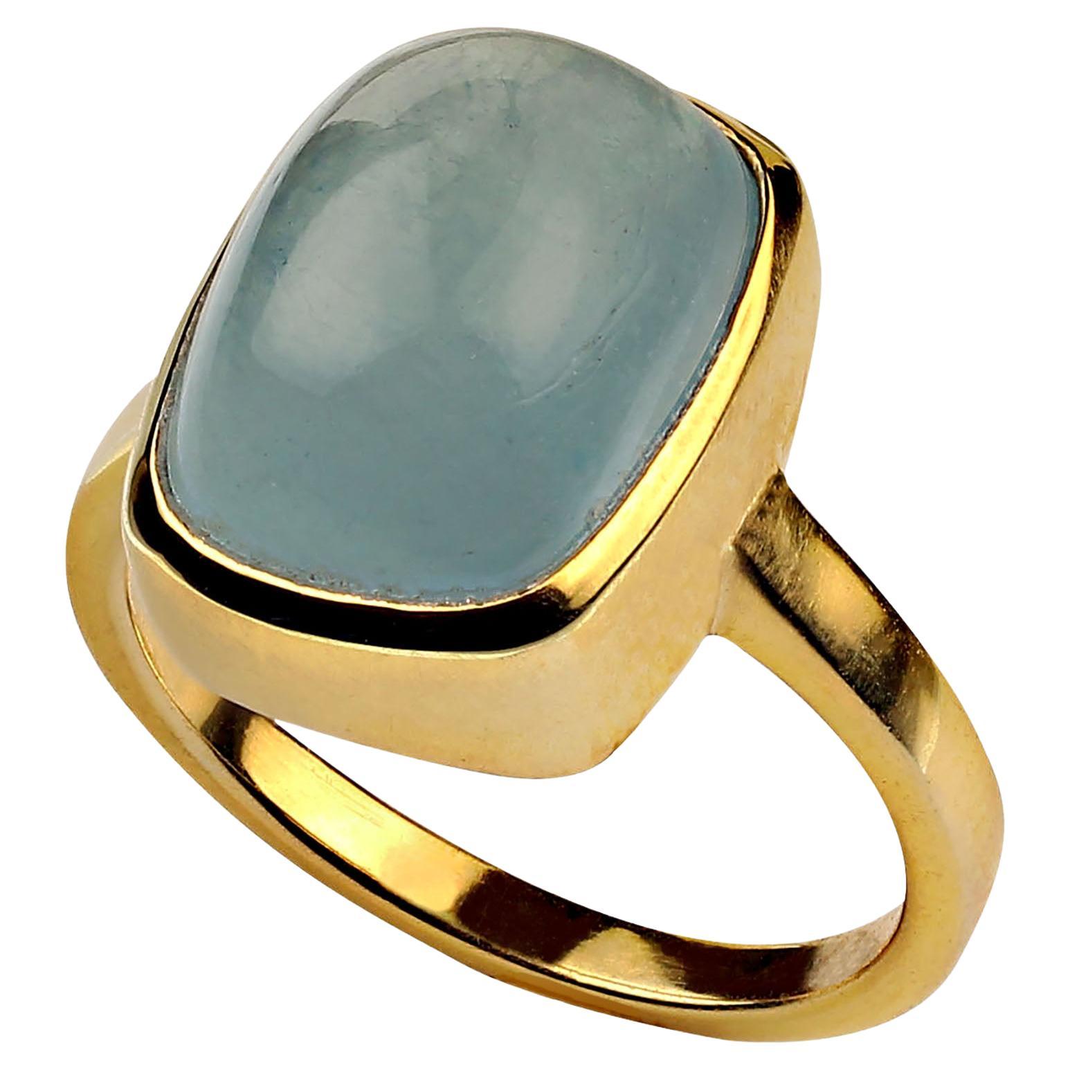 Awesome Aquamarine cabochon bezel set in gold rhodium over Sterling Silver ring.  This is a pleasing rounded rectangle shape for the gorgeous 13.51ct gemstone.  14x11mm. Aquamarine is in the Beryl family. Also, in the Beryl family you will find in