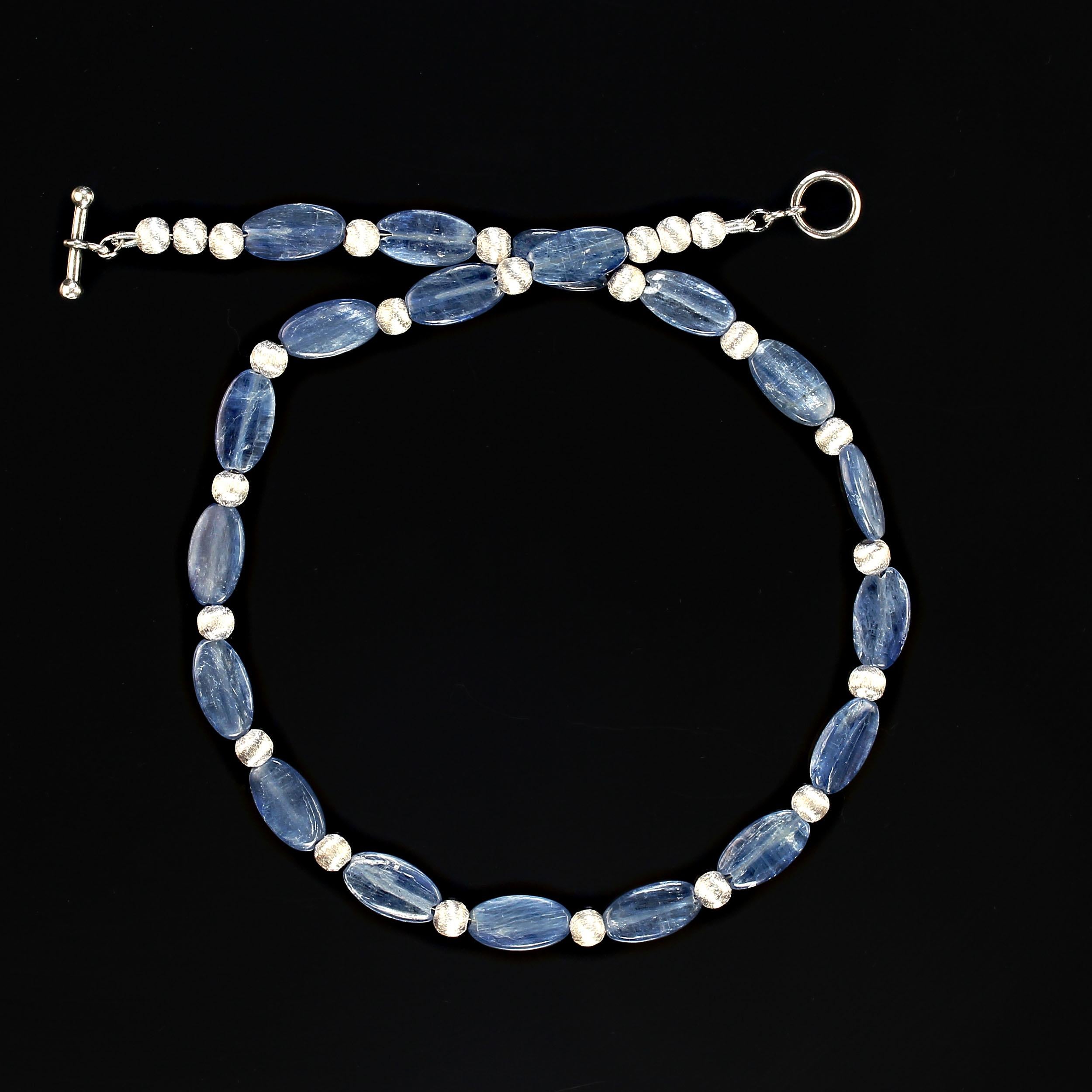 15 Inch blue kyanite and silver tone beads choker necklace. The kyanite, 14x5mm, and silver tone beads, 5mm, have parallel striations. This delightful necklace is secured with a silver toggle clasp.  MN2390