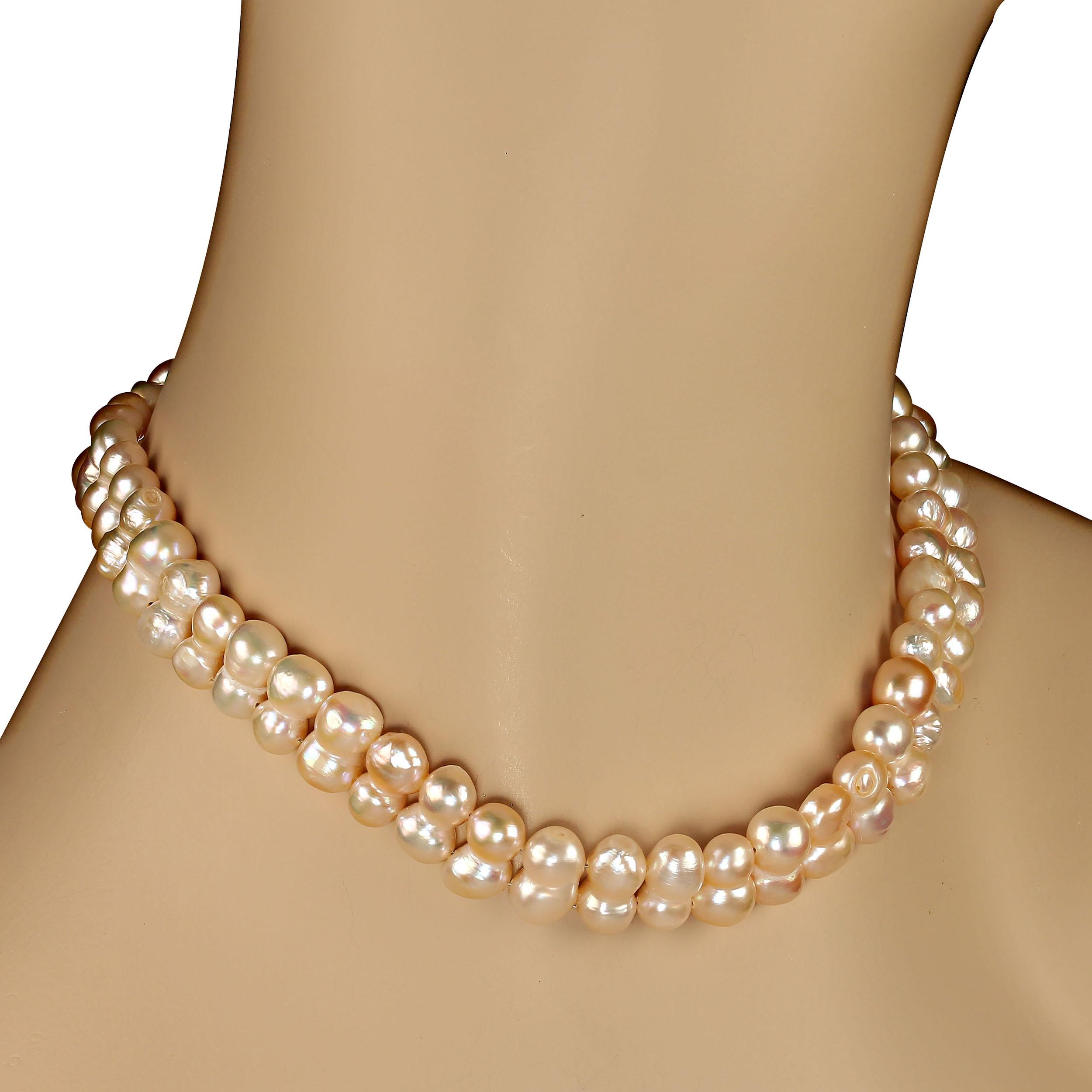15.5 Inch choker pearl necklace of two strands.  These pearls developed attached so they sit together perfectly for a choker necklace. Wear this 15.5-inch necklace however it fits you best. The pearls are a light pinkish-white and is 13x7mm. It