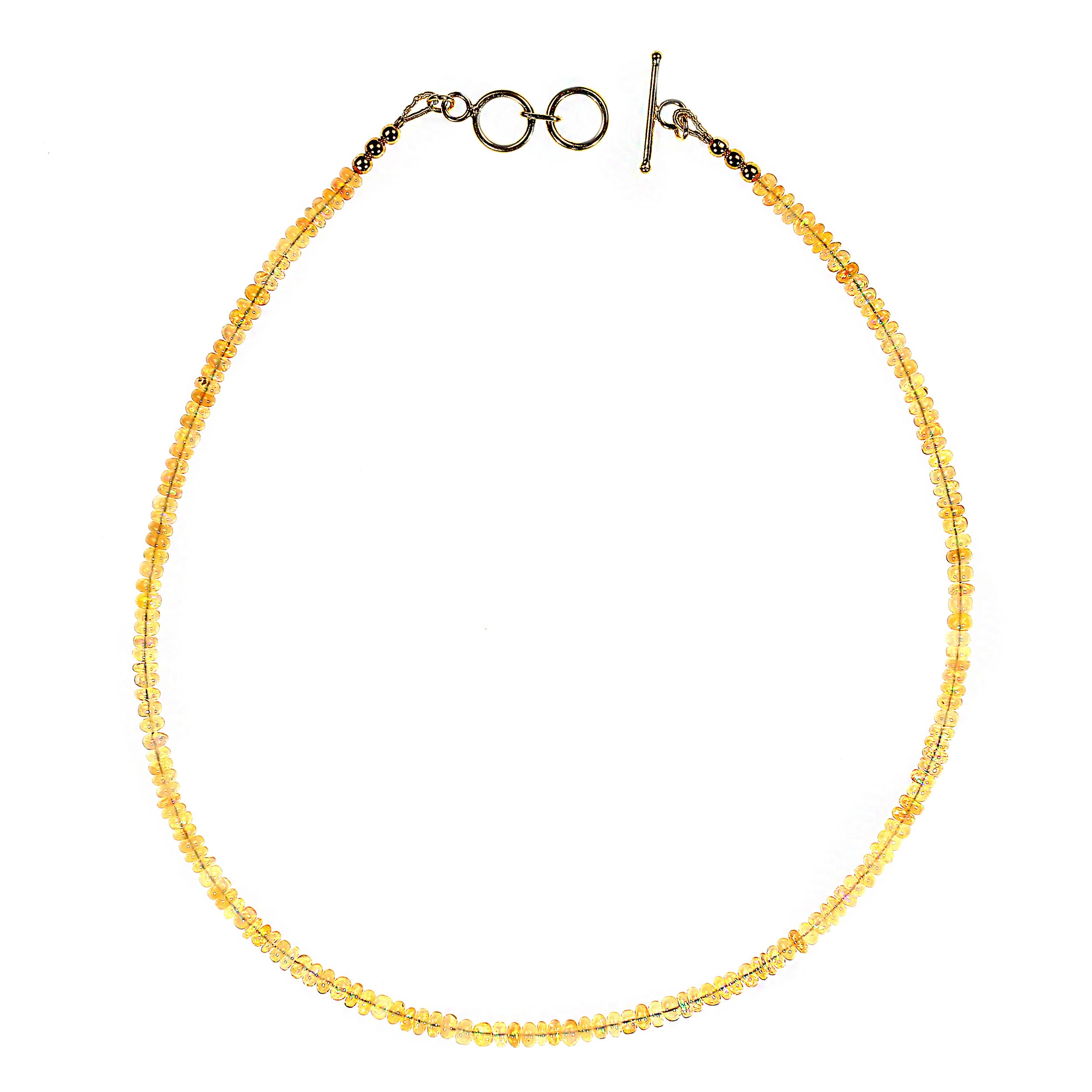 Elevate your jewelry collection with this exquisite 16-inch opal necklace, a timeless piece that radiates elegance and charm. Crafted with 4mm smooth rondel opal beads, each stone showcases a captivating play of color—flashes of soft pinks, blues,