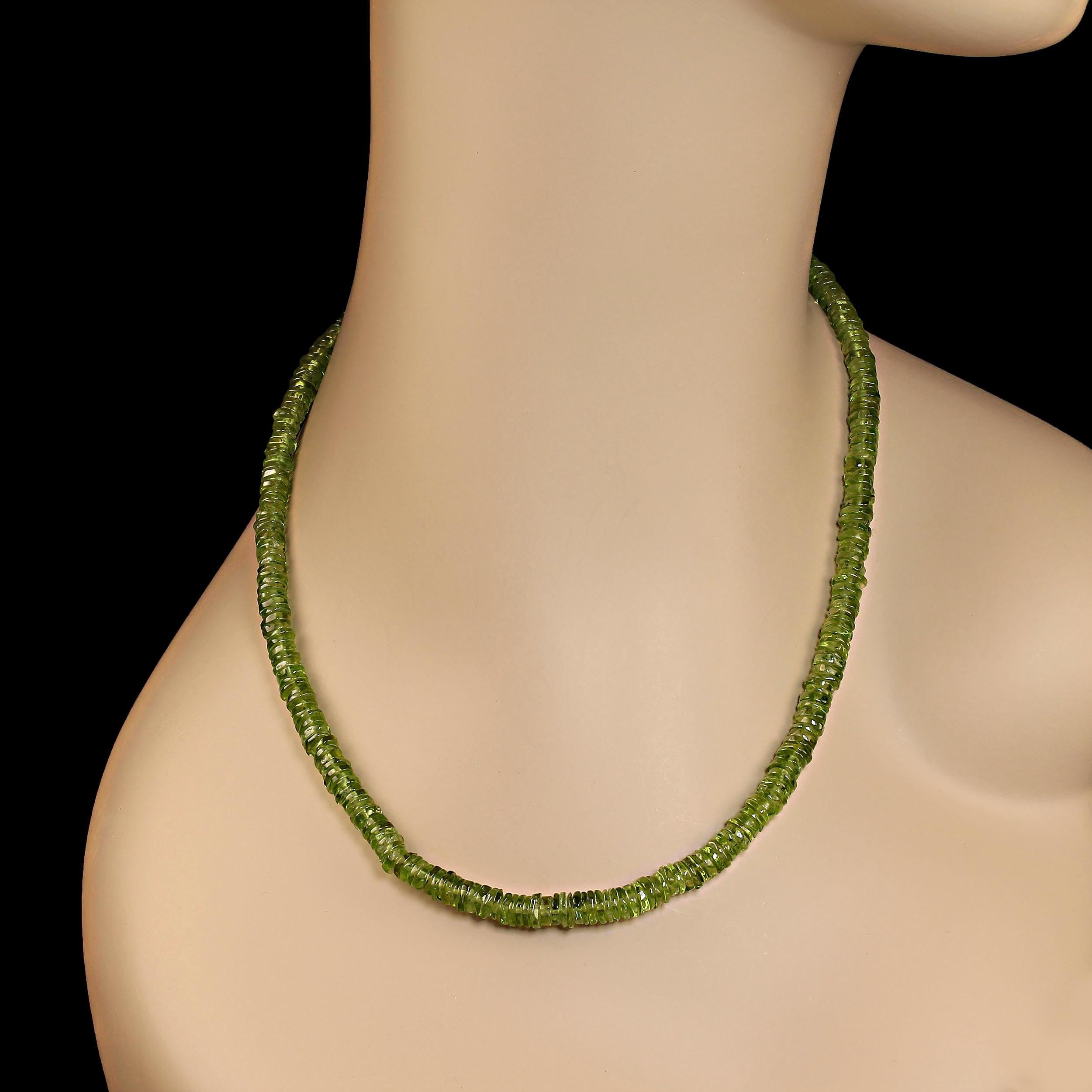 16 Inch choker necklace of glowing green peridot rondelles, 5mm.  These elegant gemstones sit side by side to create a tight, solid look of perfect peridot green.  The necklace is secured with a silver lobster claw clasp with  extra loops for