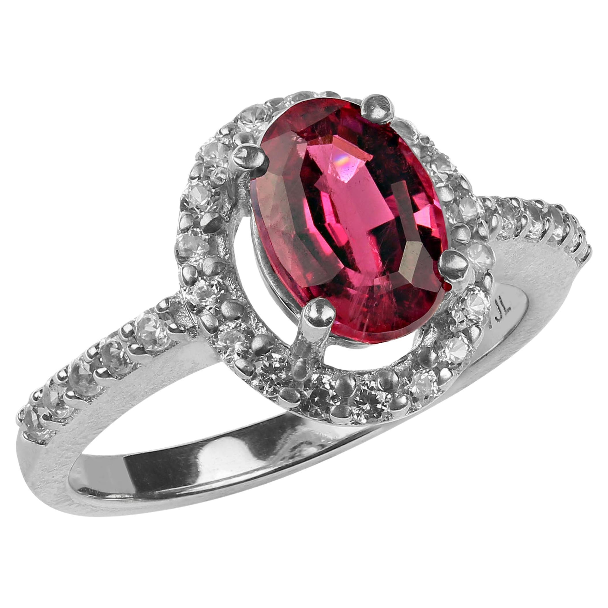 Happy Valentine's Day!
Glittering 1.6ct oval rubelite accented with 0.57ct of genuine white zircons all set in glowing sterling silver ring. This unique ring is a 'must have.'  The gorgeous step cut oval rubelite comes straight from one of our