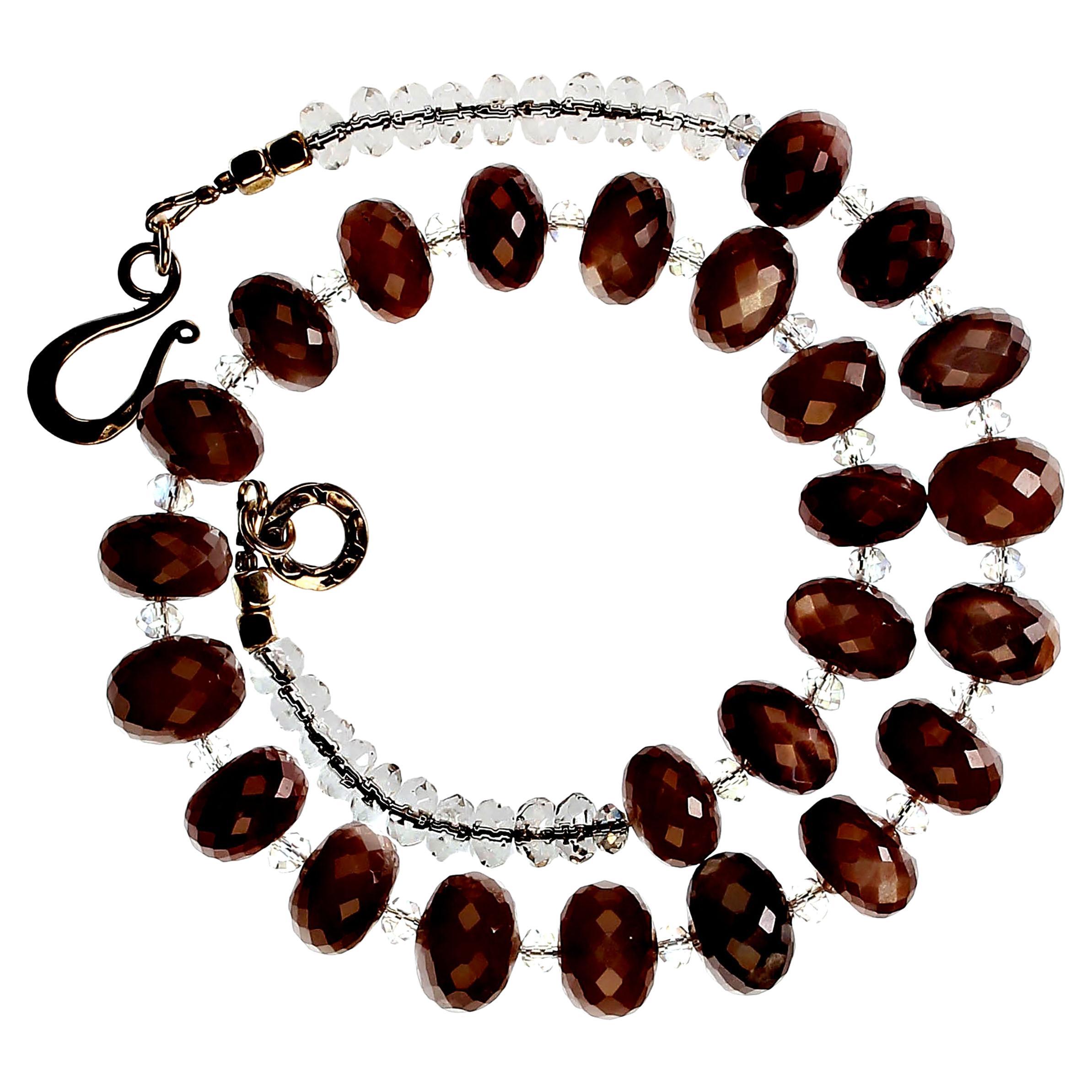 Custom made necklace of faceted chocolate Moonstone rondelles and clear faceted Crystals. This delightful necklace is 17 inches in length which allows it to sit comfortably at your neckline. The glittering chocolate Moonstone rondelles average 12