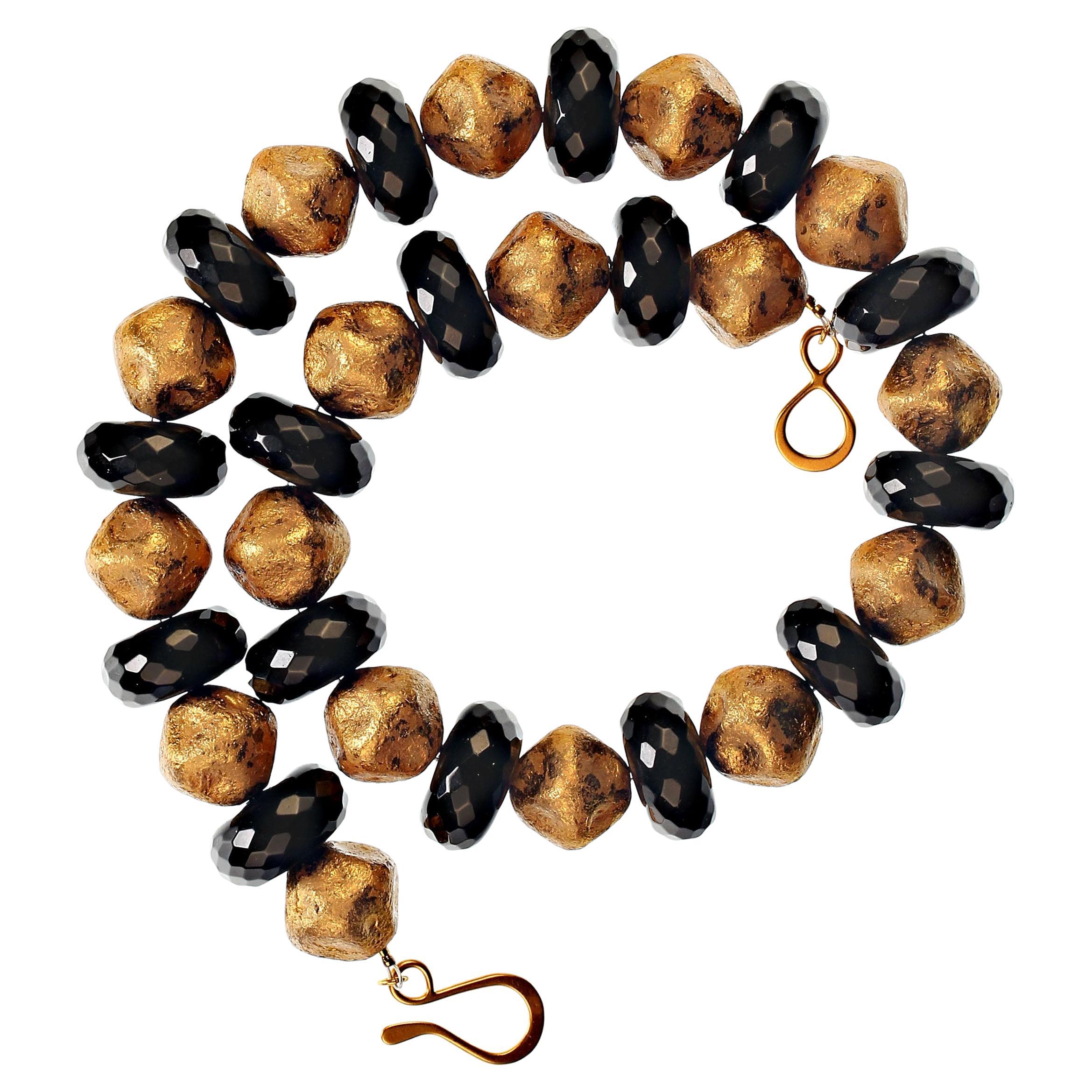 Striking look of Elegance and Style! Wear this necklace of Black Onyx rondelles and antique gold Czech beads as your pick of the day, week, year. The 19 MM Black Onyx rondelles are faceted and highly polished. The antiqued gold Czech beads are