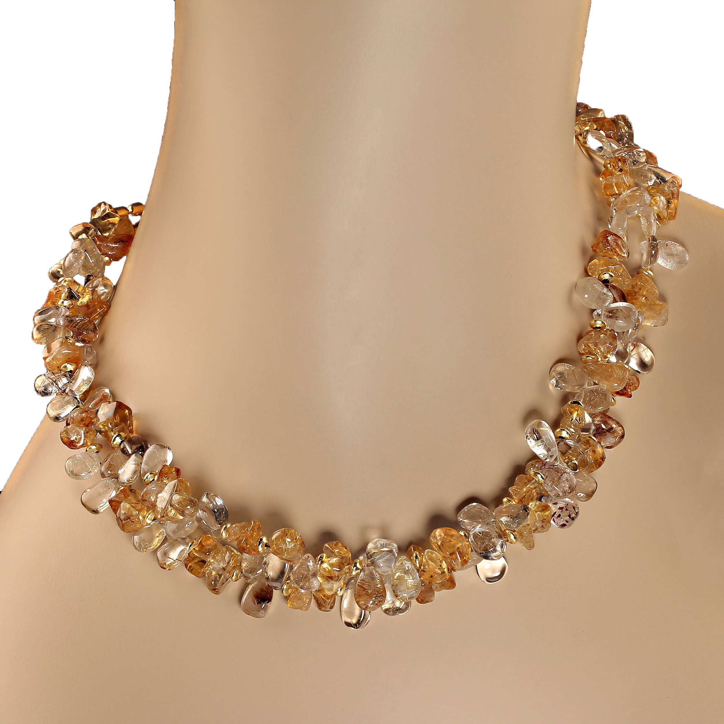 18 Inch two strand necklace of highly polished briolettes of rutilated quartz, 8x7mm, polished, tumbled citrine chips, and goldy spacers. The necklace is finished with a gold vermeil clasp with diamond chips. This necklace creates a lovely sparkly