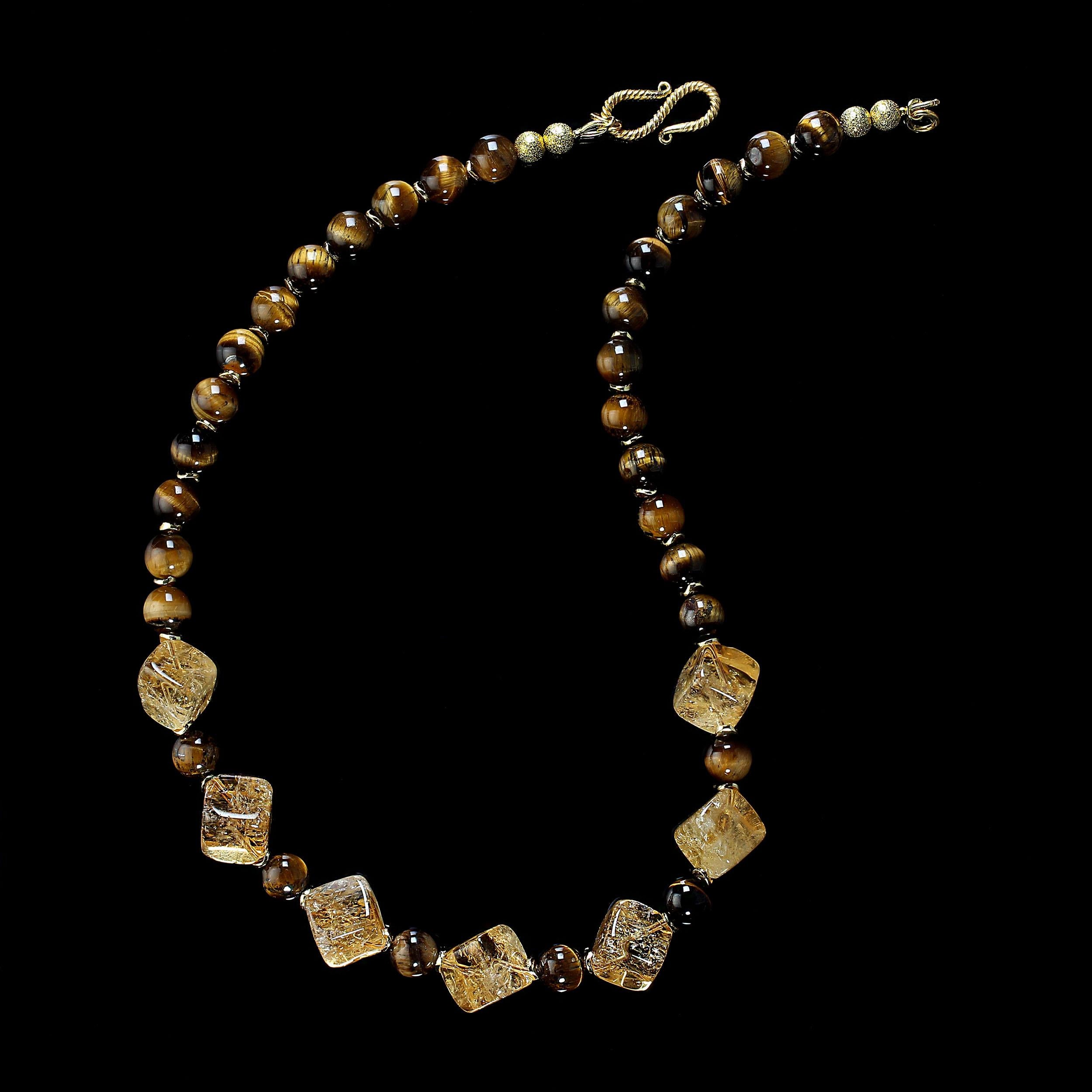 18-Inch Unique golden citrine and tiger's eye necklace.  This one-of-a-kind necklace features beautifully cut bias drilled citrines, 12mm, and glowing, smooth 8mm tiger's eye. Gold tone flutters accent these elegant gemstones.  This necklace is
