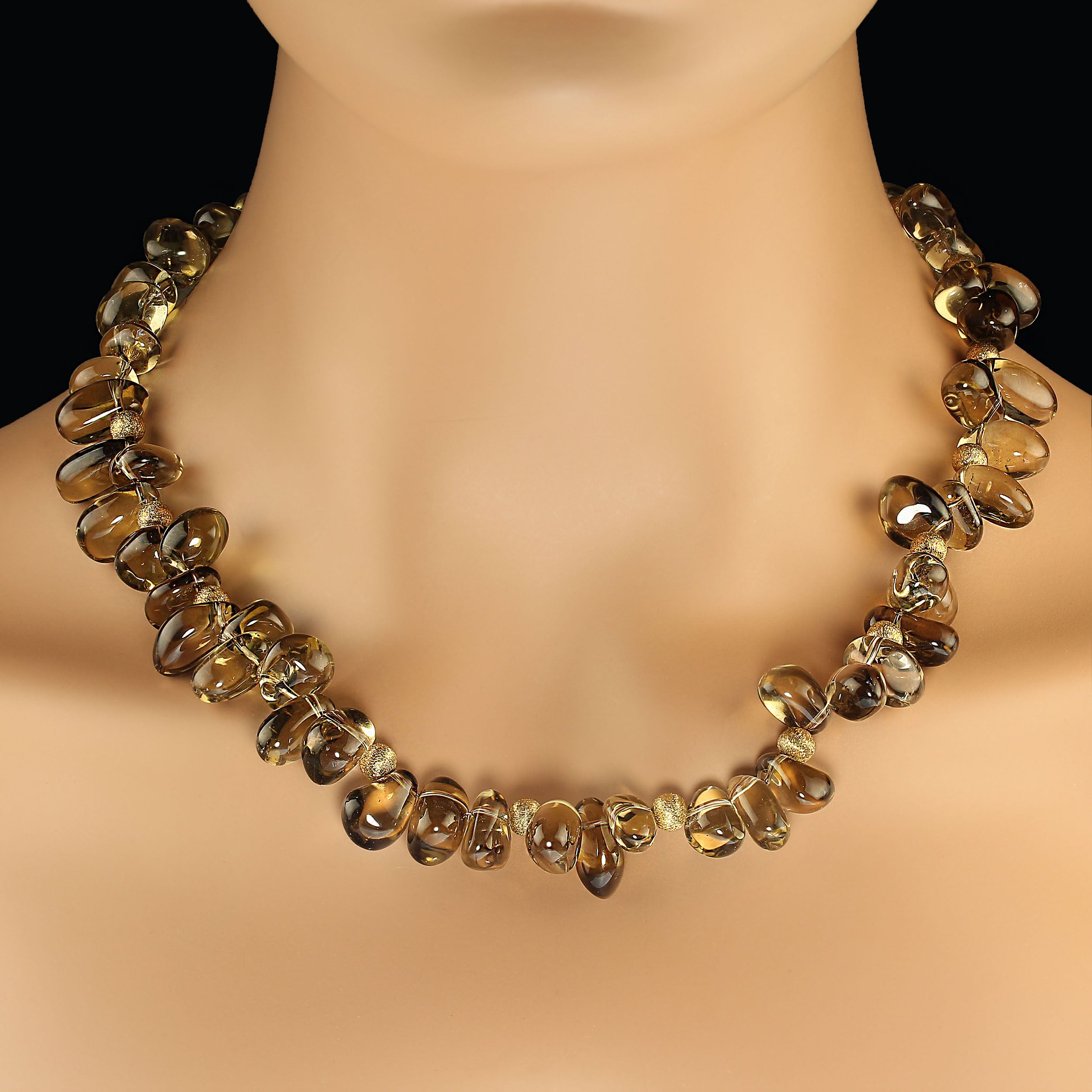Absolutely beautiful necklace of smooth, transparent nuggets of smoky quartz with frosted goldy accents. This incredible necklace is such a pleasure to wear.  At 19 inches it is very versatile, and the color is perfect. MN2433