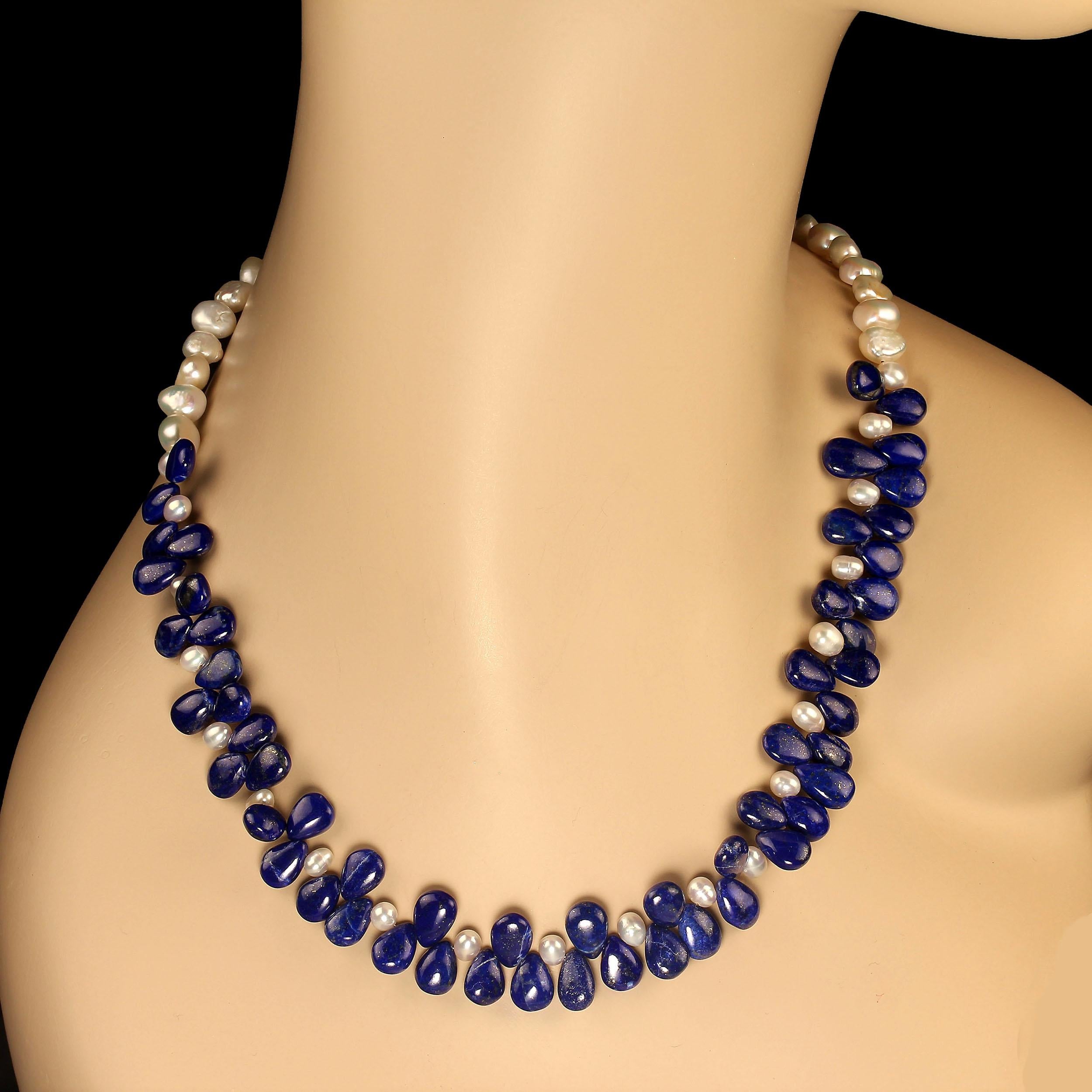 20-inch one-of-a-kind necklace of lapis lazuli smooth 9x7 highly polished gemstones accented with creamy white 5mm pearls and double shine 9x7 pearls. This 20-inch necklace is secured with a gold antiqued pewter toggle clasp. MN2403