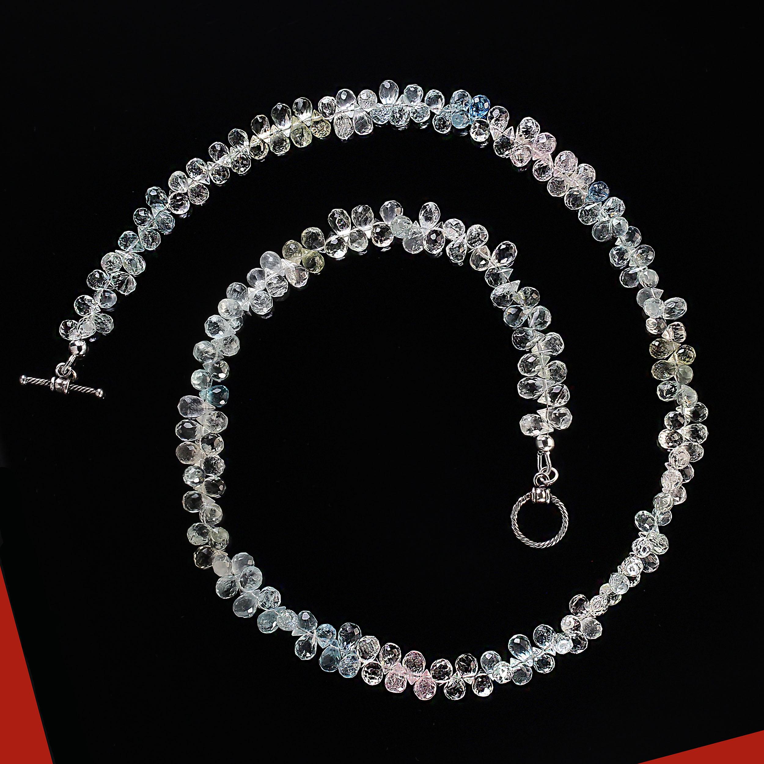 20-Inch necklace of multi color sparkling briolette beryls. These 6mm, faceted glittering beryls are all the usual beryl colors with aquamarine and morganite featured.  This unique and very wearable necklace is secured with a delicate twisted silver