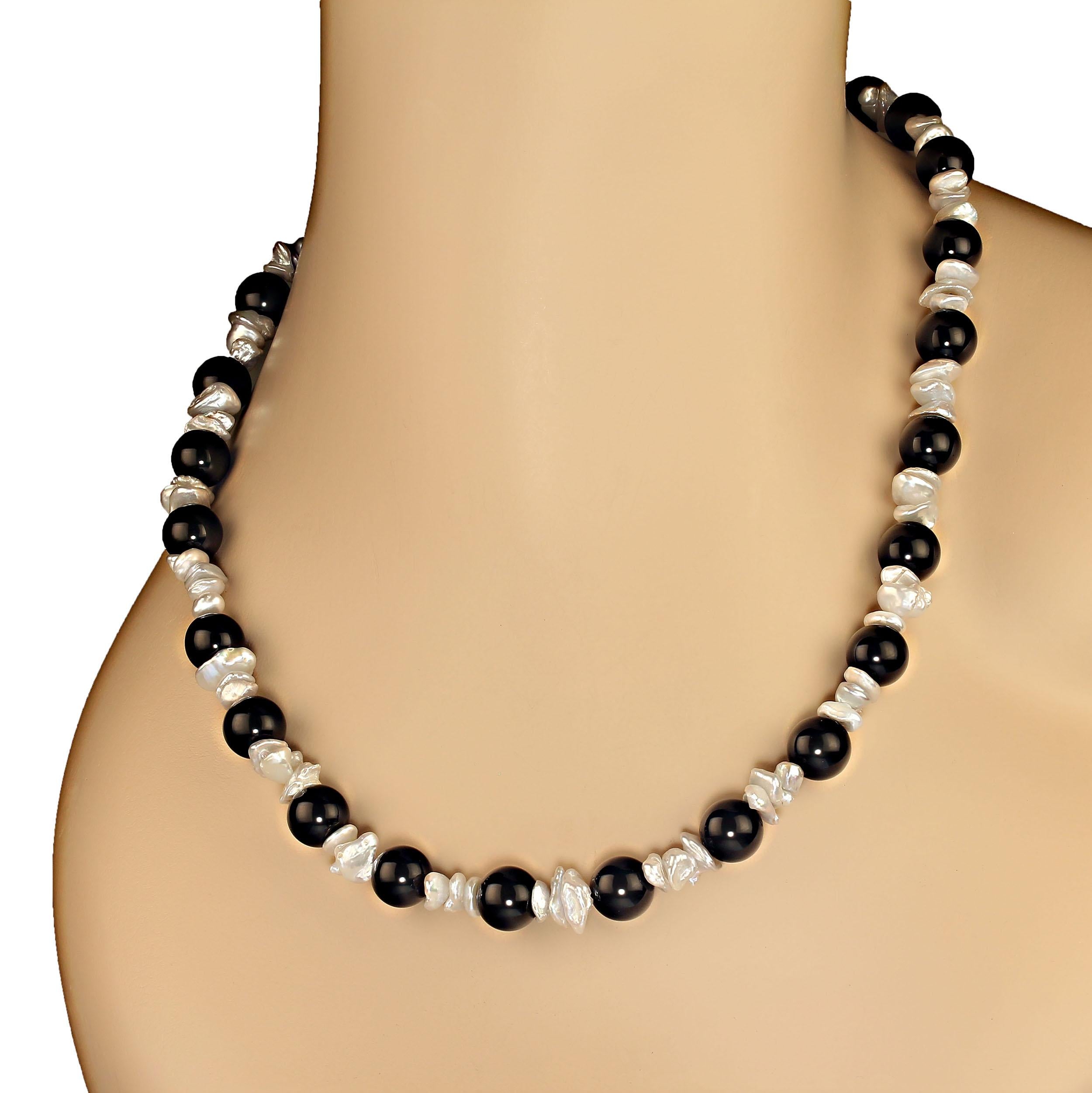 20 Inch gray iridescent biwa pearls mixed with highly polished 10mm black onyx create this elegant and so very wearable necklace. The 6mm biwa pearls are each unique and iridescent so they don't sit just side by side.  This is a great necklace for