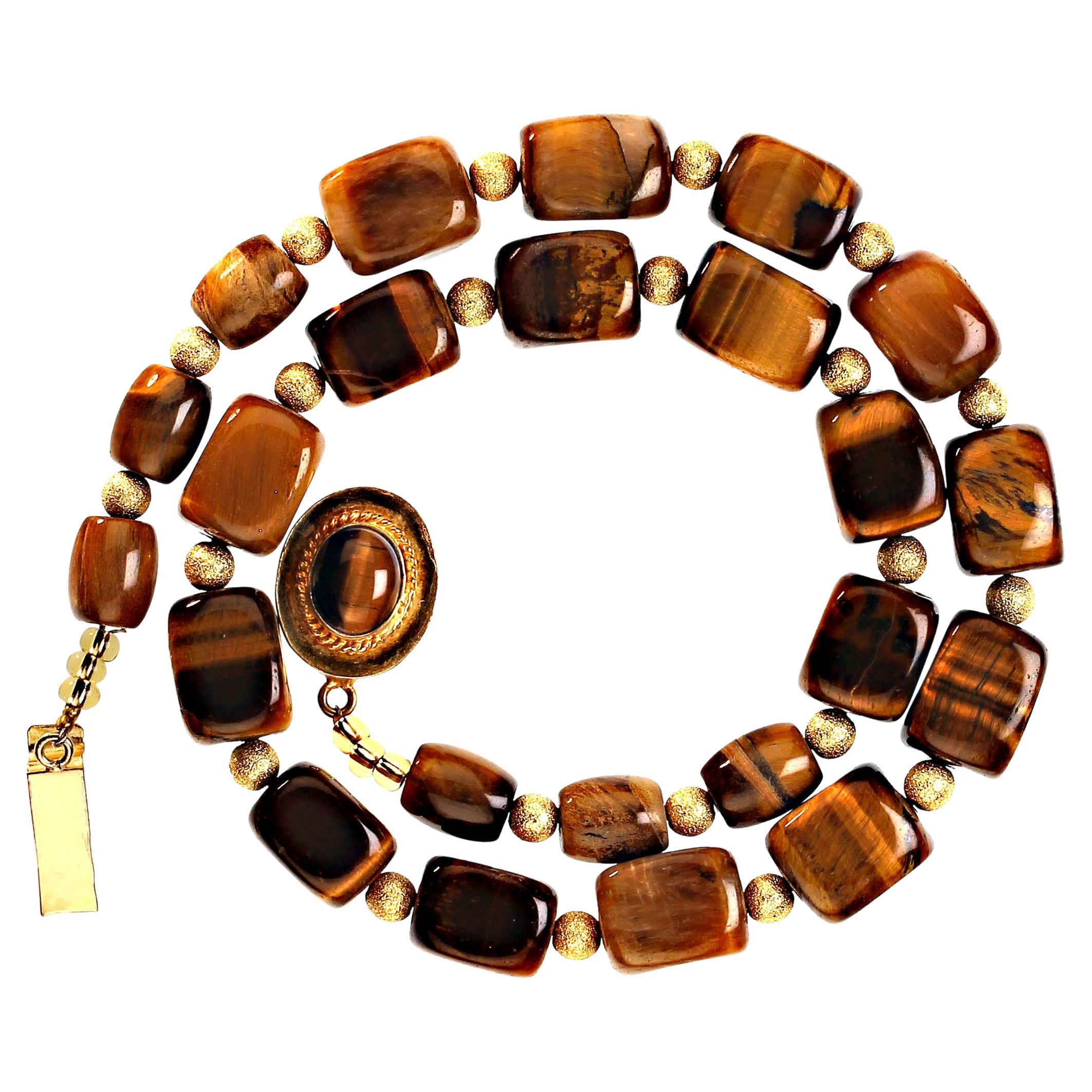 Very Special Necklace of unusual cubes of Tiger's Eye with a lovely chatoyant luster spaced with brushed gold tone spheres. This necklace has an over all length of 20 inches and is finished with a gold tone clasp featuring, of course, a Tiger's Eye