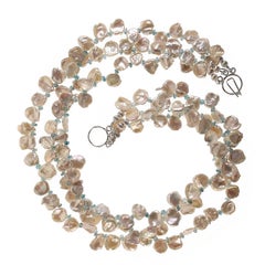 AJD 20 pouces de perles Keshi blanches accentuées de zircons bleus 