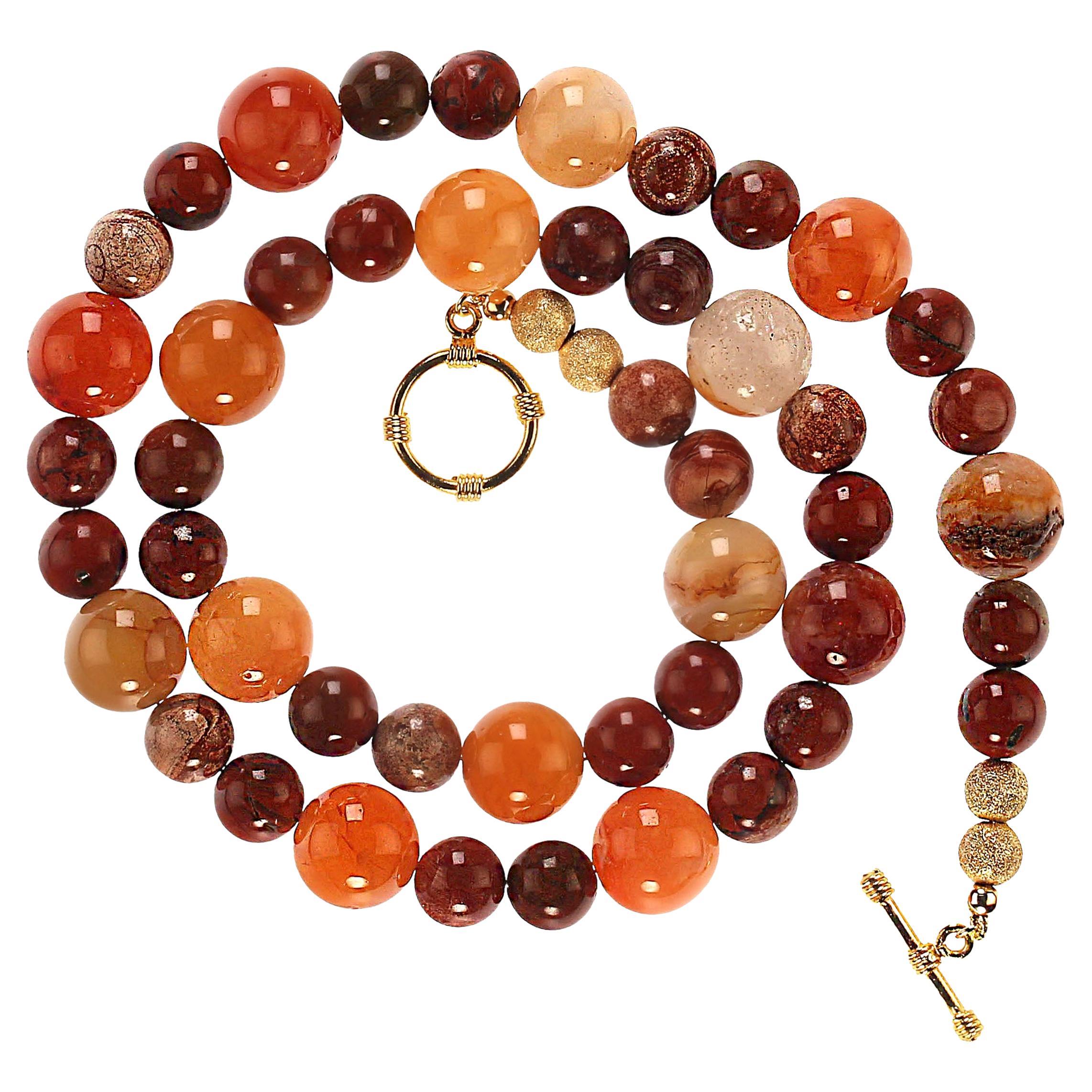 23-Inch Gorgeous glowing golden brown agate necklace. This one-of-a-kind necklace is features brown, goldy, orange, and creamy agates in 14 and 10 mm.  The necklace is secured with a gold plate toggle clasp.  MN 2428