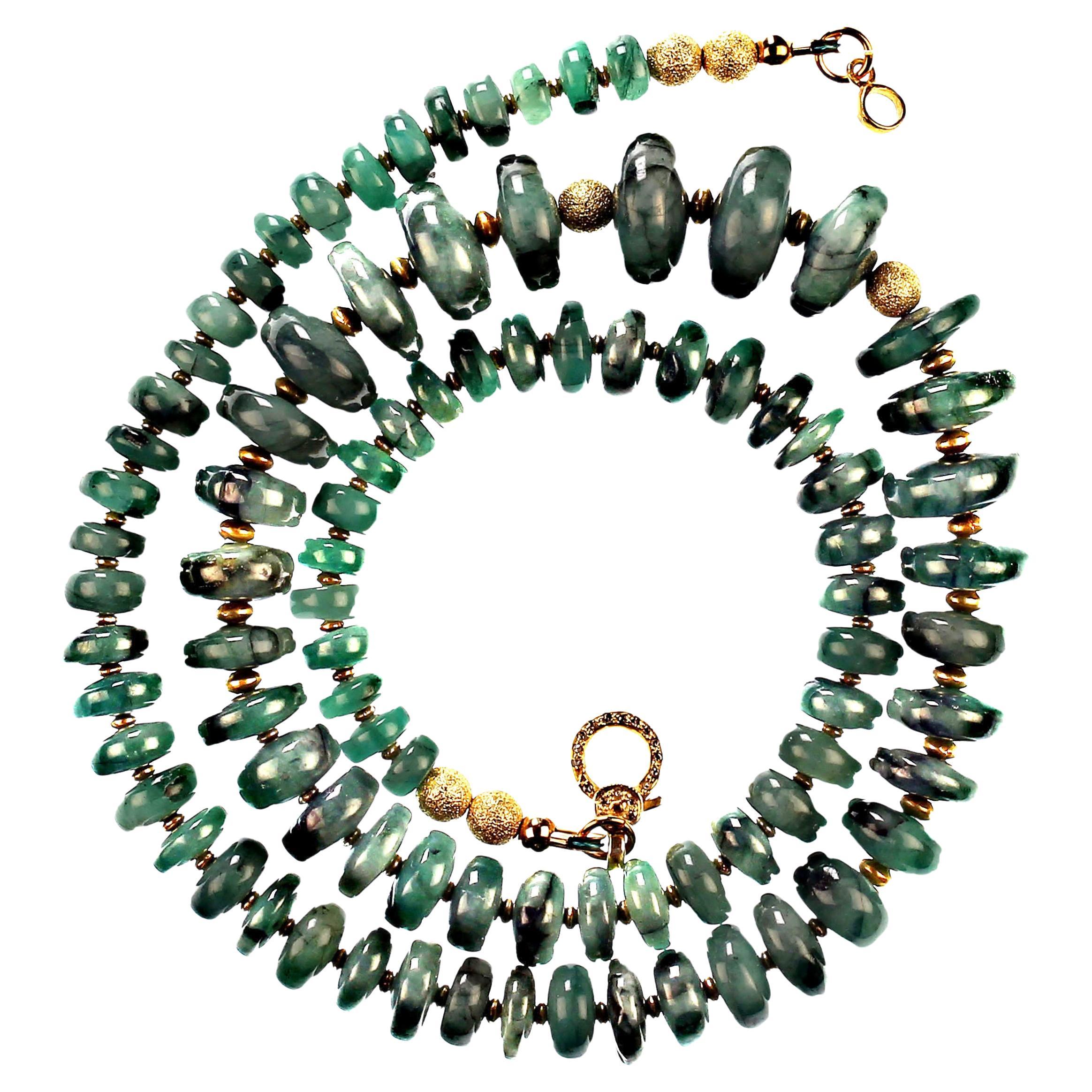 23 Inch necklace of highly polished Emerald matrix graduated rondelles.  These lovely Emerald rondelles are accented with rondelles of gold 22K plate over copper and finished with a vermeil and diamond studded lobster claw clasp.  Green is the