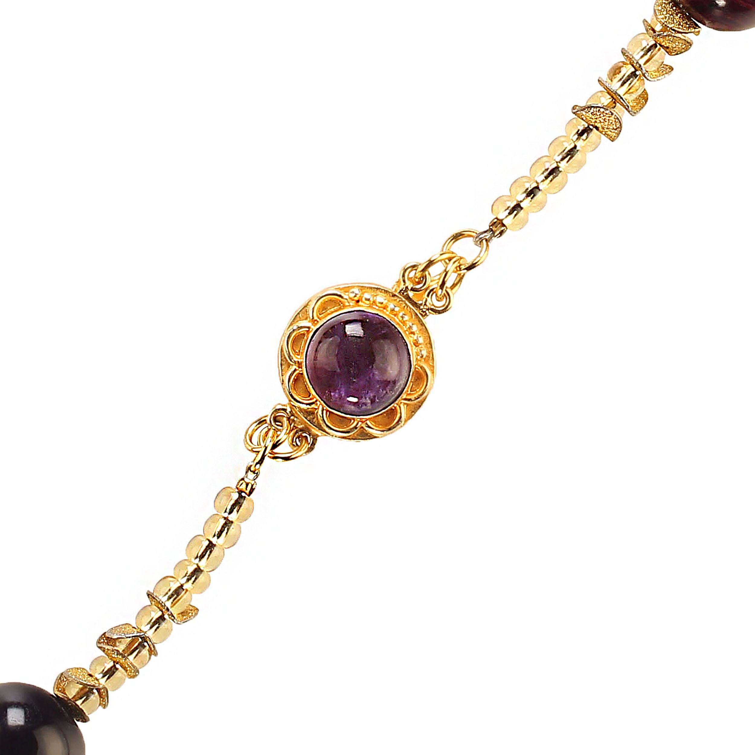 Custom made, highly polished 16mm spheres of Amethyst, brushed wavy gold tone accents, and gold Czech bead necklace.  Statement necklace of February's Favorite gemstone, Amethyst!  This unique 23-inch necklace sits beautifully on any ensemble.  The