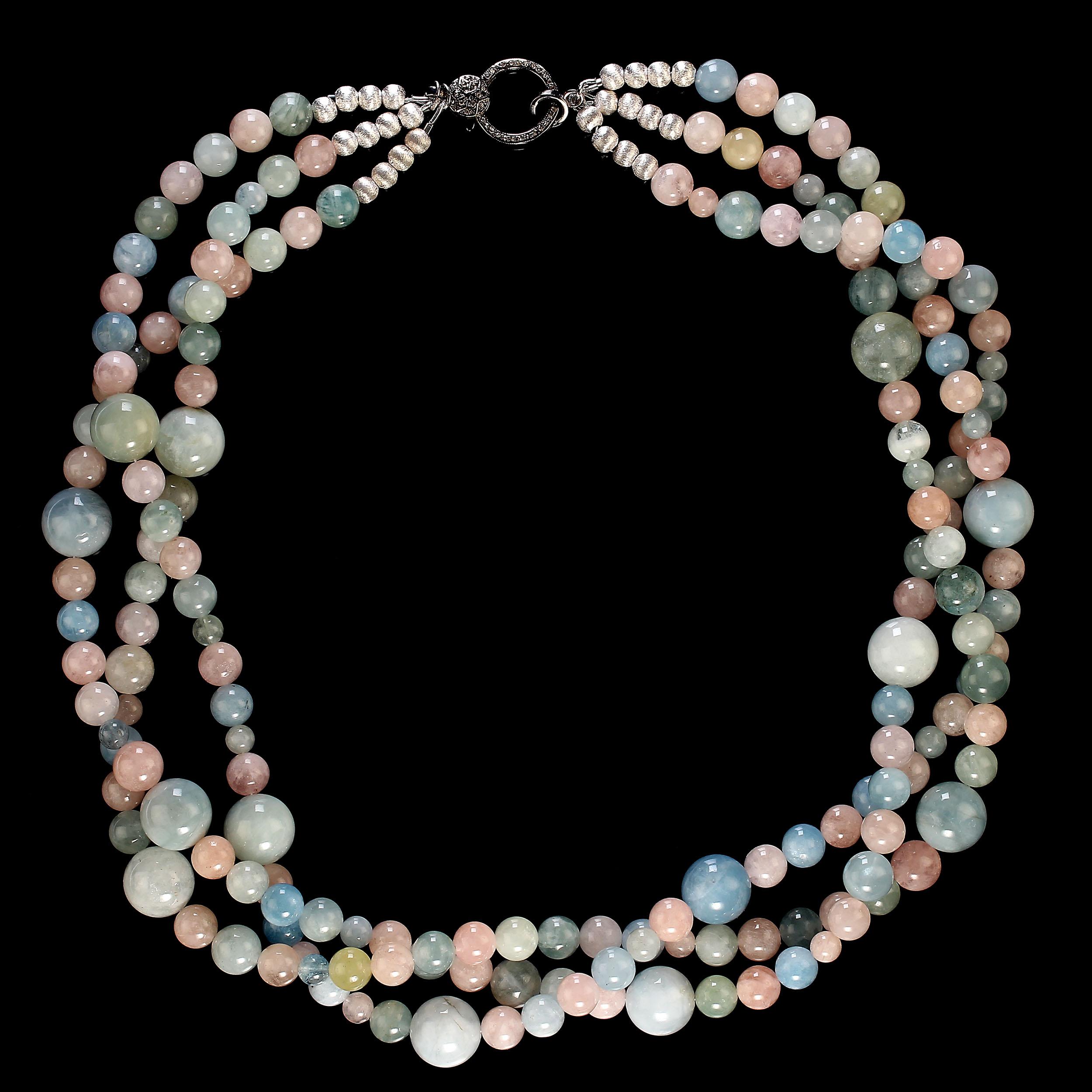 Elegant and original 23-inch three strand necklace of multi color beryls in four different sizes.  These smooth, glowing gemstones are 14, 10, 8, and 6 MM. The necklace is secured with an antiqued sterling silver lobster claw clasp with diamond