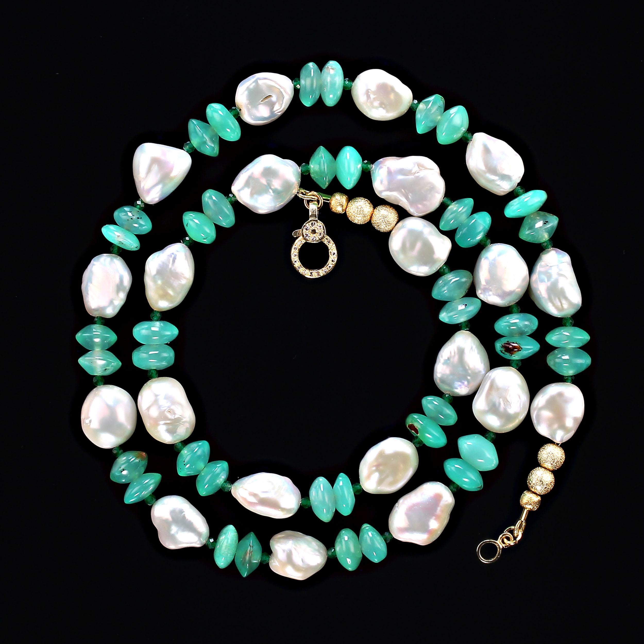 24 Inch white iridescent keshi pearl and green glowing chrysoprase necklace.  This glorious necklace combines the best of both pearl and gemstone.  The translucent green chrysoprase is accented with green 2mm green quartz rondelles. The necklace is