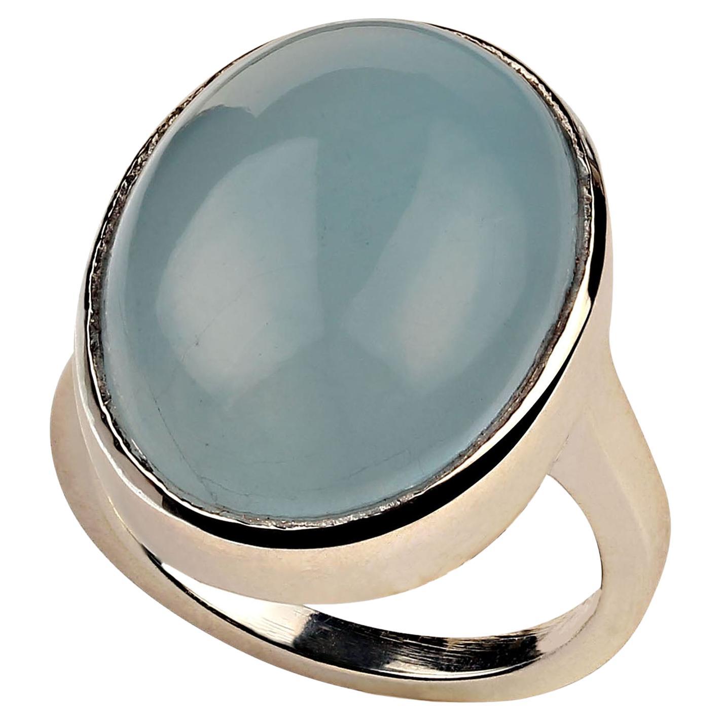24ct astonishing Aquamarine oval cabochon bezel set in Sterling Silver ring. Gorgeous, large, 22x17MM,  translucent aquamarine set in just the right amount of sterling silver to accent the beauty of this gemstone. Aquamarine is in the Beryl family.