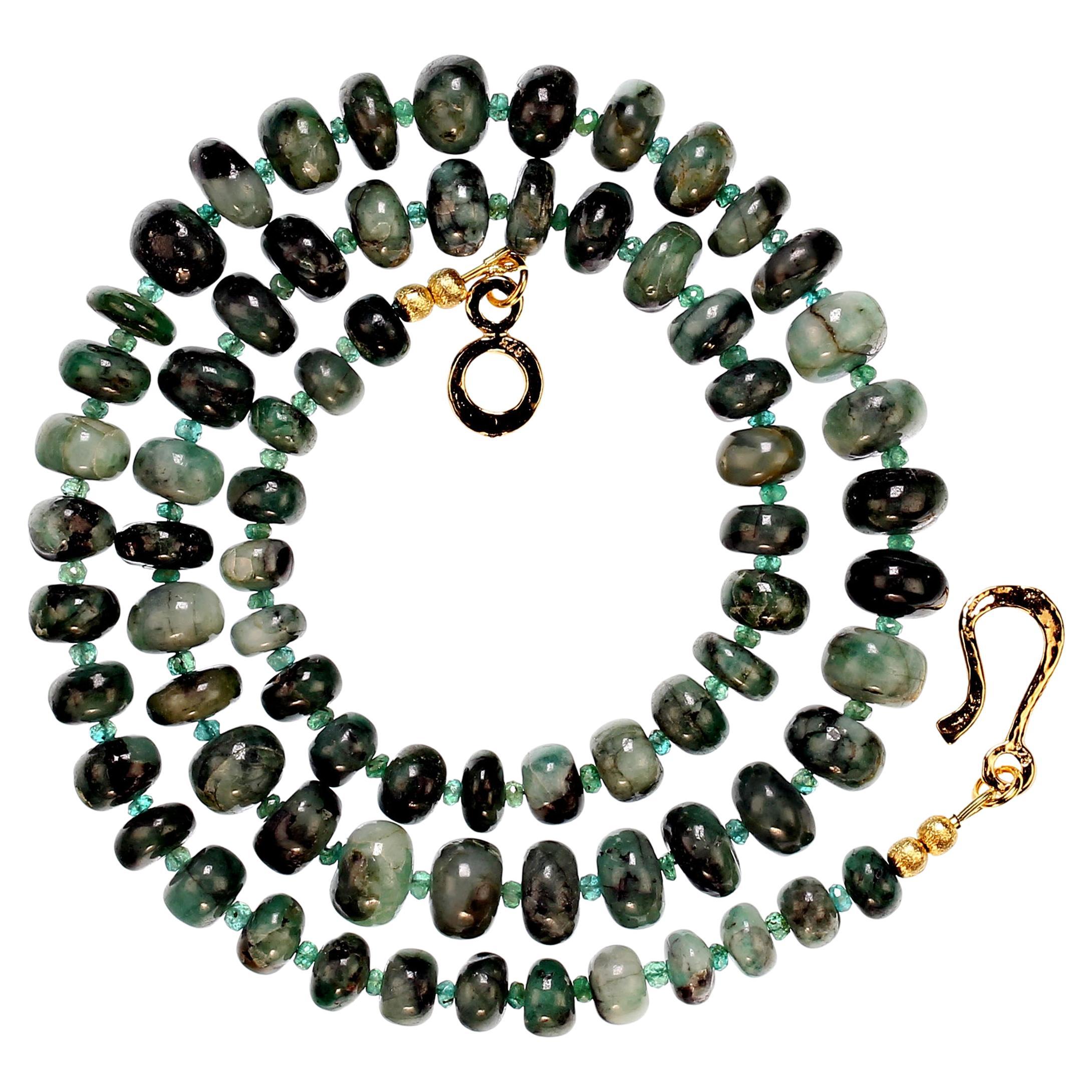 25 Inch graduated emerald matrix necklace with faceted emerald, 3.5mm, accents.  The emeralds graduate 8-11mm and are lovely highly polished smooth rondelles. The necklace is secured with a yellow vermeil 14K hook and eye clasp.  MN2363