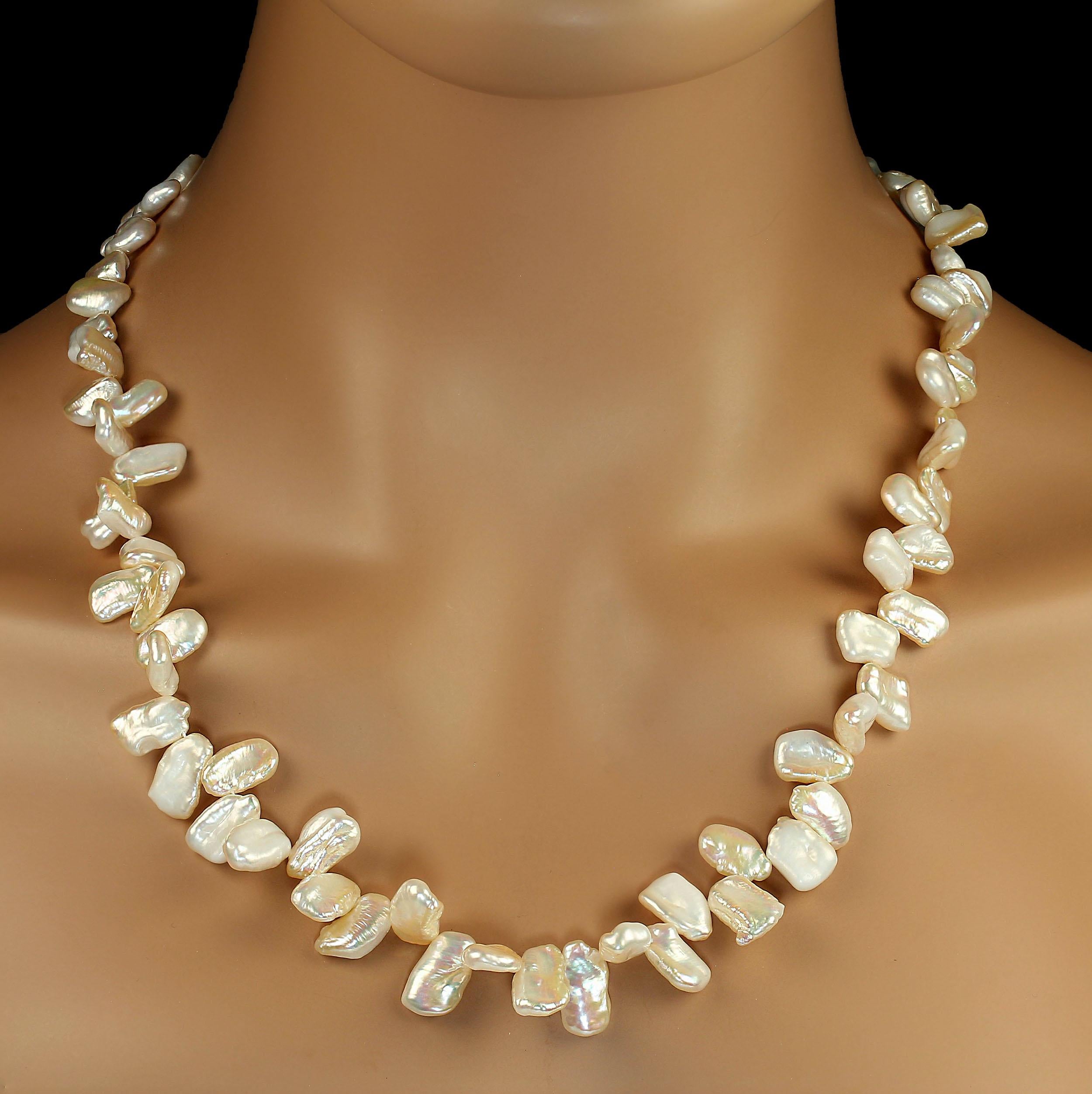 Chic 27-Inch Peachy Freshwater Pearl Necklace – A Wardrobe Essential

Add a touch of elegance to your look with this lovely 27-inch freshwater pearl necklace. Featuring slightly graduated pearls in a soft, peachy hue, this necklace exudes a warm