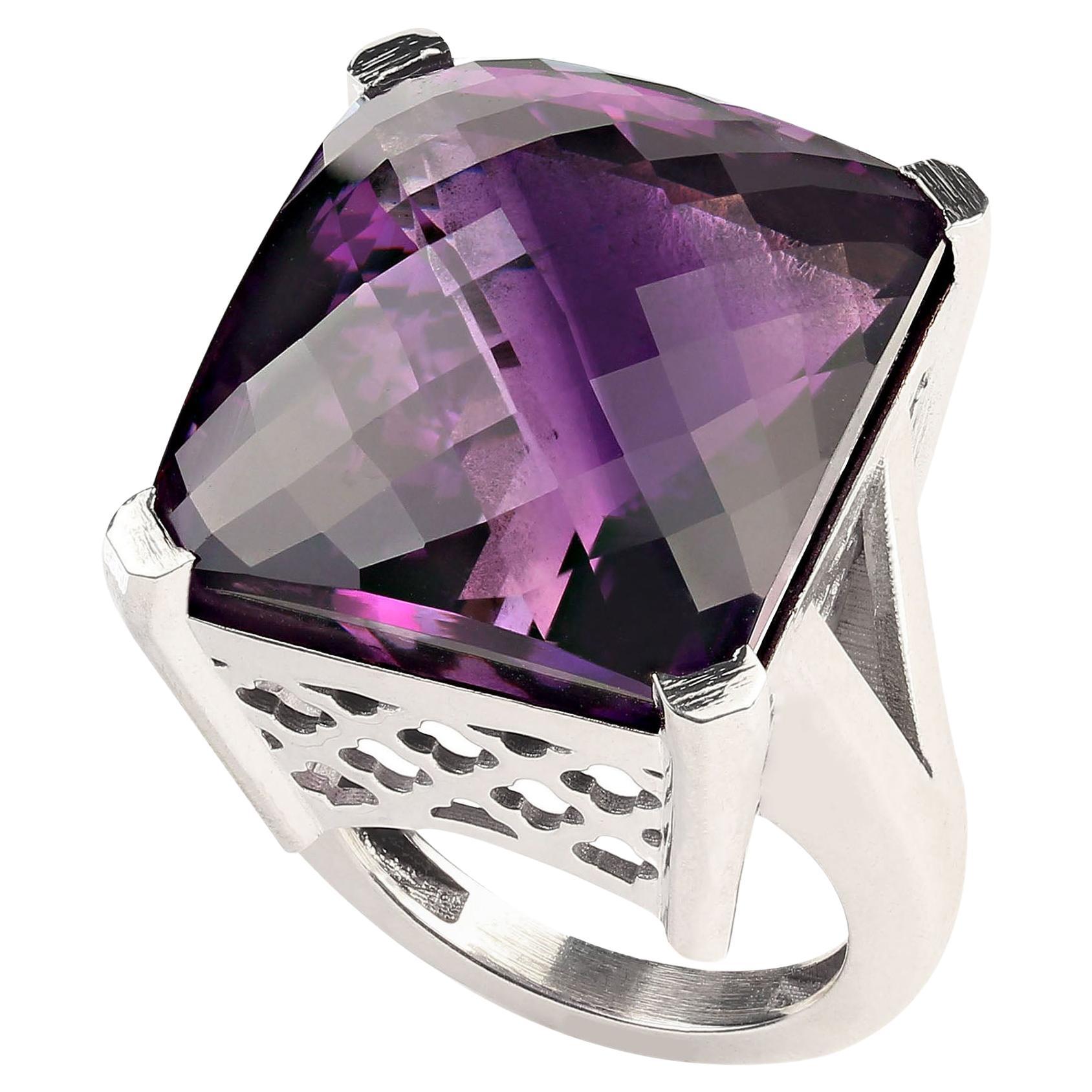 56Ct Square Awe-Inspiring Amethyst with a checkerboard table in custom made Sterling Silver setting.  This one of a kind ring is stunning, the 23x21MM Amethyst is almost knuckle to knuckle.  Amethyst is the February birthstone and is said to protect