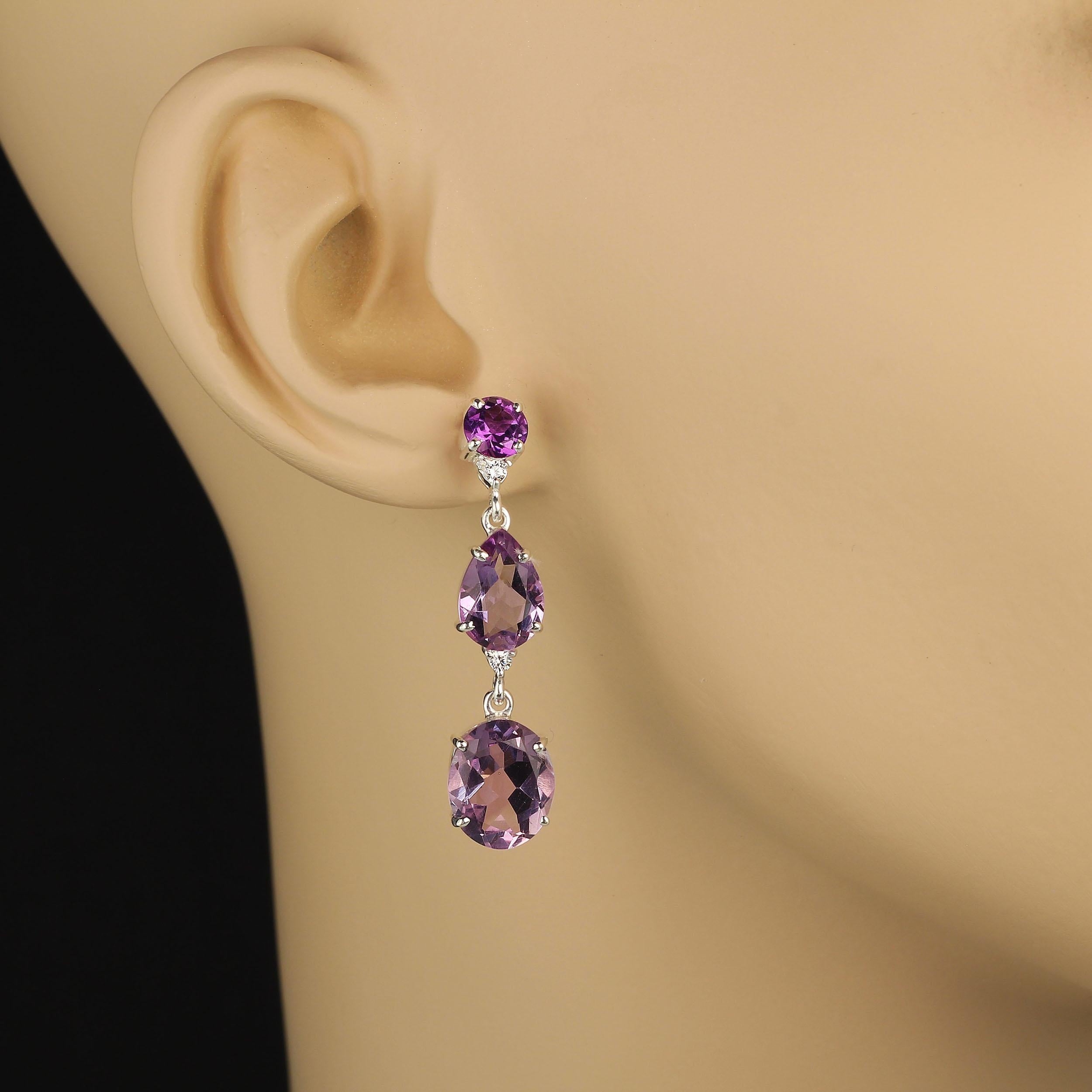 Amethyst Triple Charm dangle earrings. Wear these gorgeous three Amethyst on each ear earrings for such a glamorous look.  The round darkest gemstone is on top and has the post back. The middle Amethyst is a lovely pear shape followed by an oval.
