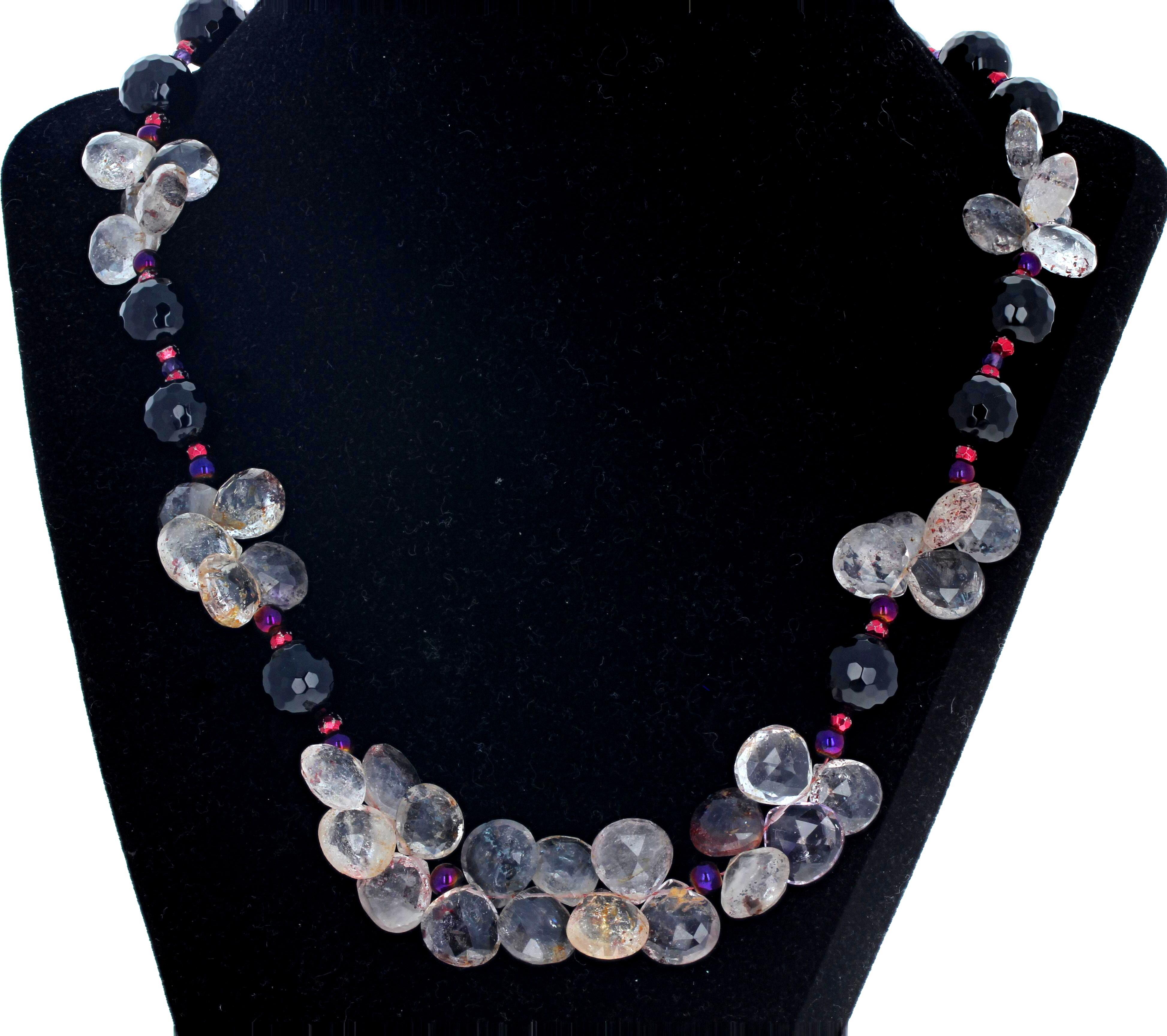 The sparkling natural gem cut Black Onyx (approximately 12mm) enhance the fascinating colors, shapes, and designs of the natural Rutilated Quartz.  The clasp is a silver plated easy to use hook clasp.  This 20 inch long necklace is quite dramatic