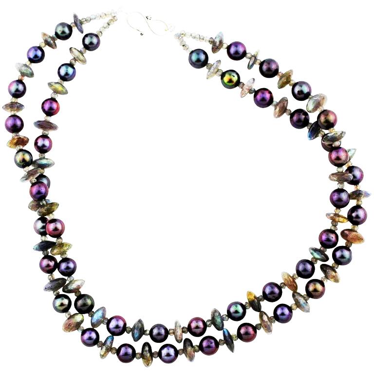 Double strand of sparkling natural unique Labradorite gem cut rondels and beautiful glowing aubergine colored Pearls handmade Necklace..  Size:  Labradorites approximately 11.5 mm;  Length:  18 inches;  Clasp:  silver tone. If you wish faster