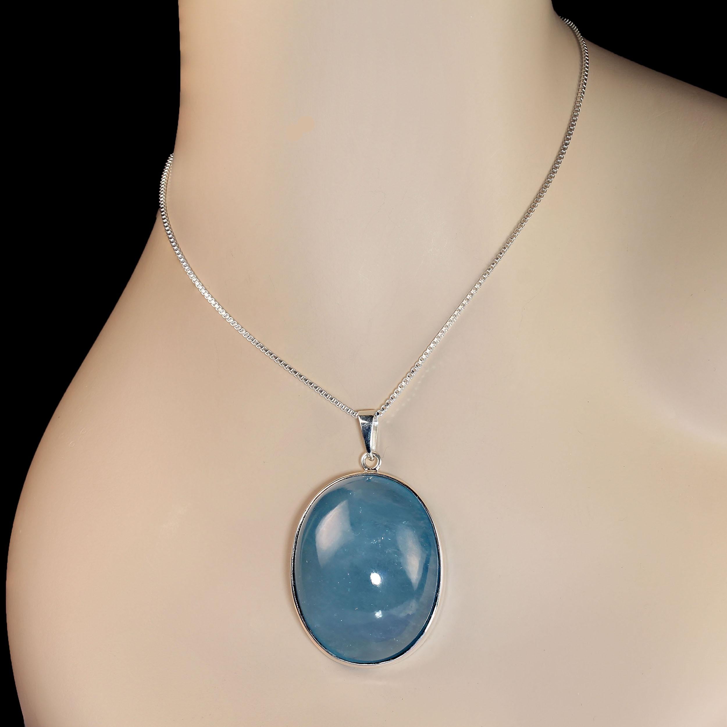 Awesome Aquamarine pendant of 160 carats in Sterling Silver.  This gorgeous 43 X 35 MM cabochon gemstone is something to behold. It is set in its own handmade Sterling Silver bezel setting that was made in Belo Horizonte, Minas Gerais, Brazil. And
