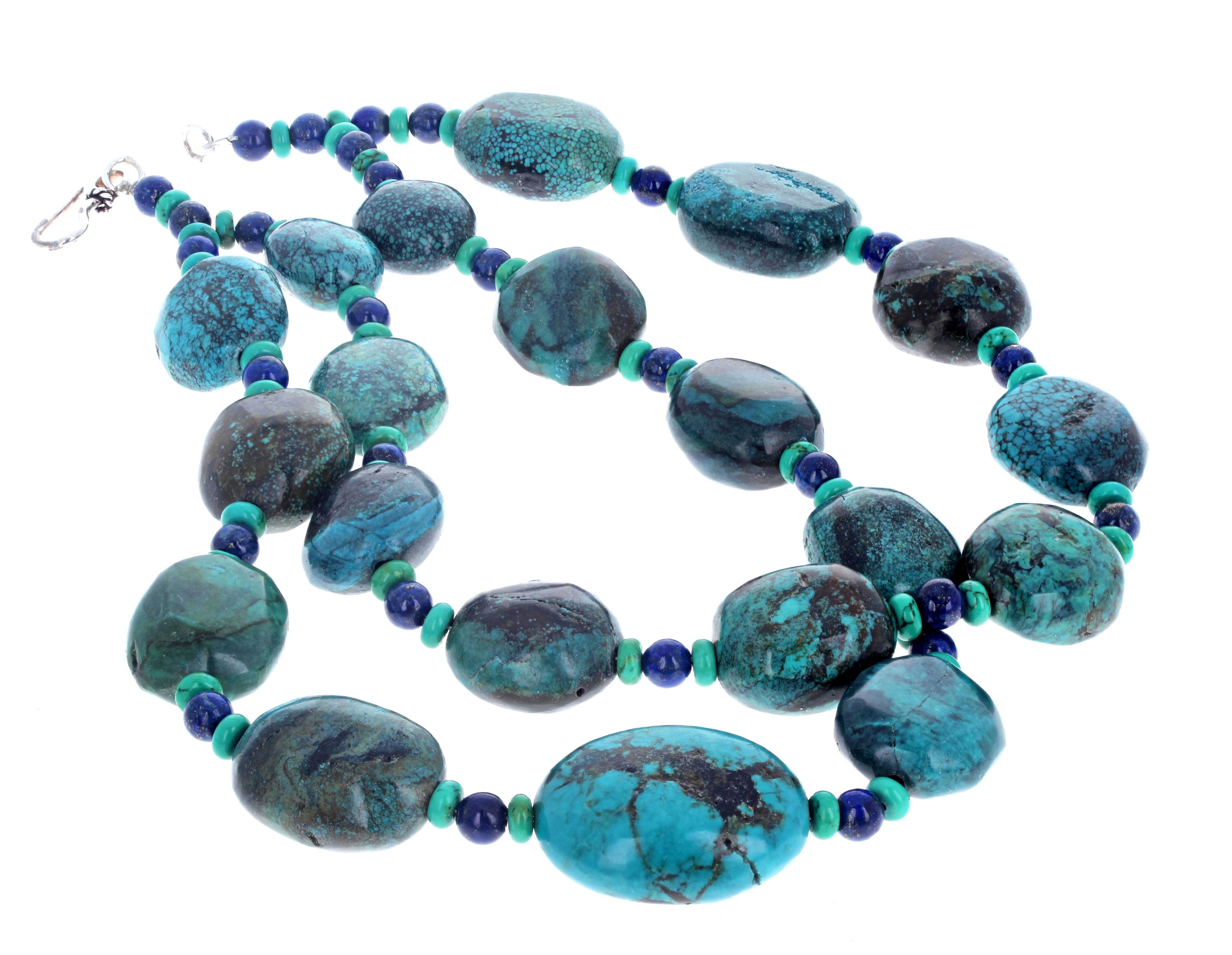 This necklace is absolutely fascinatingly beautiful.  It is natural highly polished real Turquoise enhanced with little highly polished little round blue lapis lazuli color rondels and measures 17 1/2 inches long.  The largest of the Turquoise is