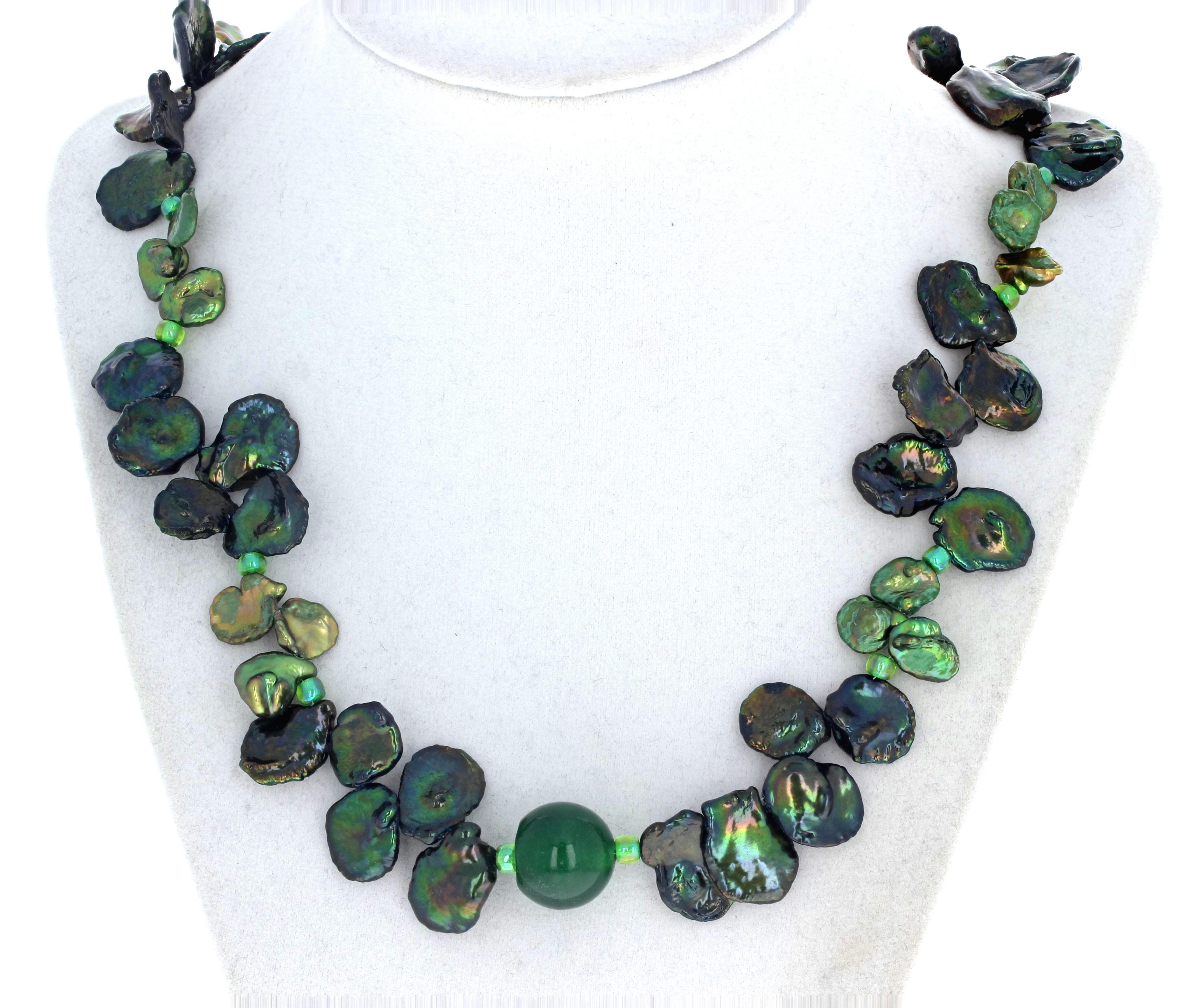 These beautifully glistening real peacock green Keshi Pearls - the largest approximately 15mm x 18mm - are enhanced with a 16mm almost round natural real green polished Jade.  This necklace is 19 1/2 inches long and the clasp is an easy to use