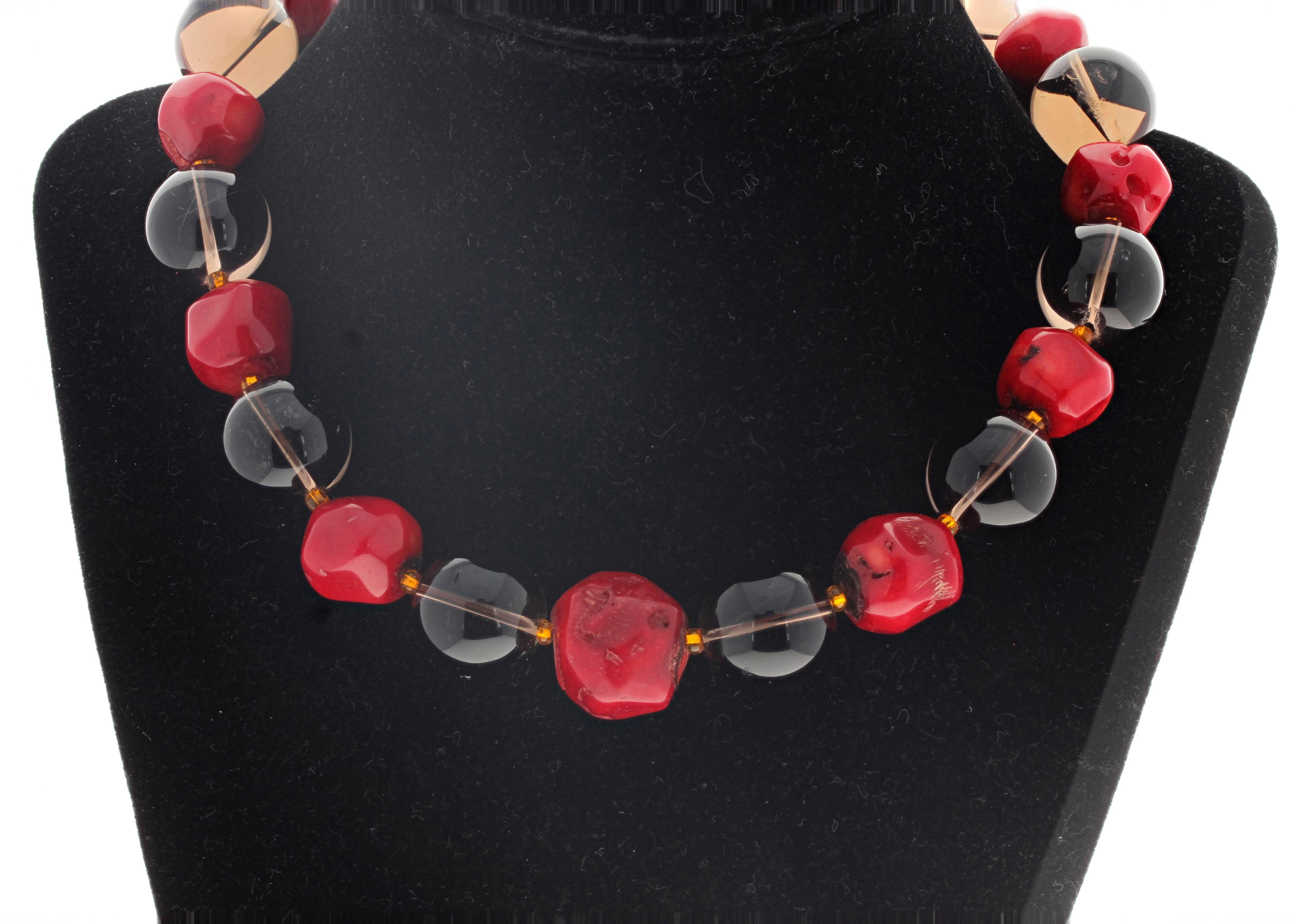 This magnificent natural Red Coral and huge big clear cleanly translucent Smoky Quartz necklace is 16 1/2 inches long.  The Smoky Quartz are 18mm round and the largest Red Coral is 19mm.  The clasp is a gold plated easy to use hook clasp. 