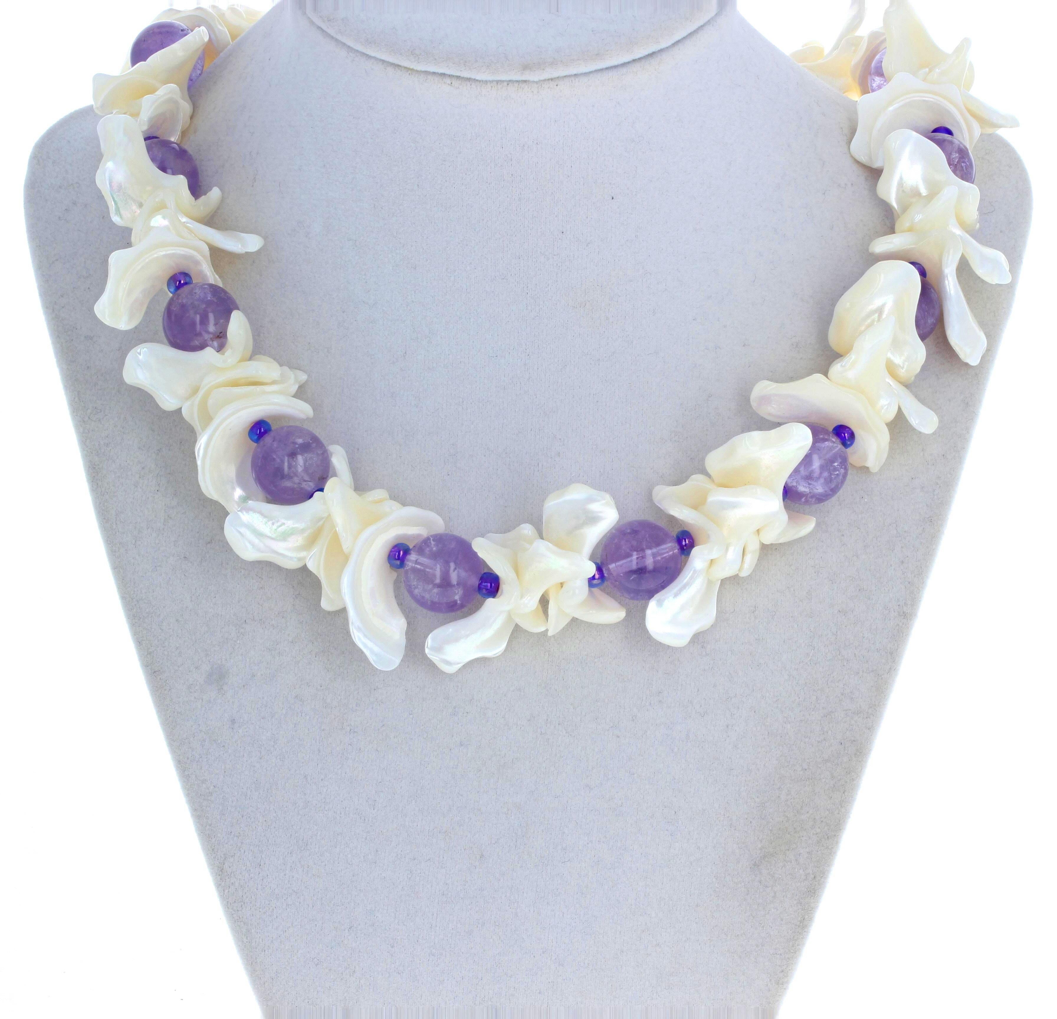 These lovely cut and polished round natural real Amethyst gemstones  - approximately 13mm - adorn the beautiful highly polished and glowing natural white Pearl shells. There are no sharp edges on these Pearl Shells.  This necklace is 18 inches long
