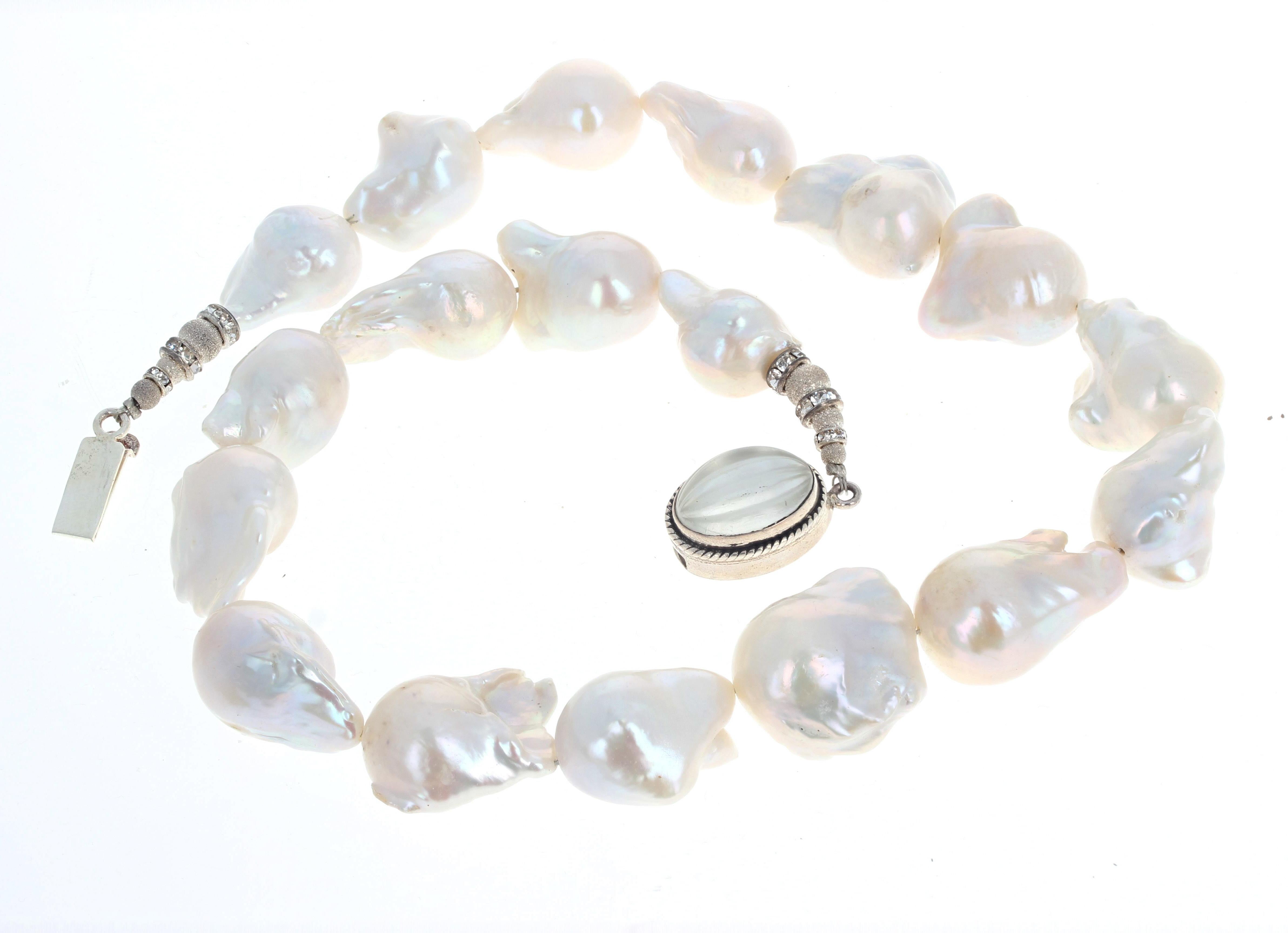 White Natural HUGE Baroque Pearls set in this beautiful 20 inch long necklace.  The largest Pearls are approximately 24mm x 21 mm.  The silver clasp is an easy to use slide-in clasp.  Absolutely gorgeous around your neck.  
