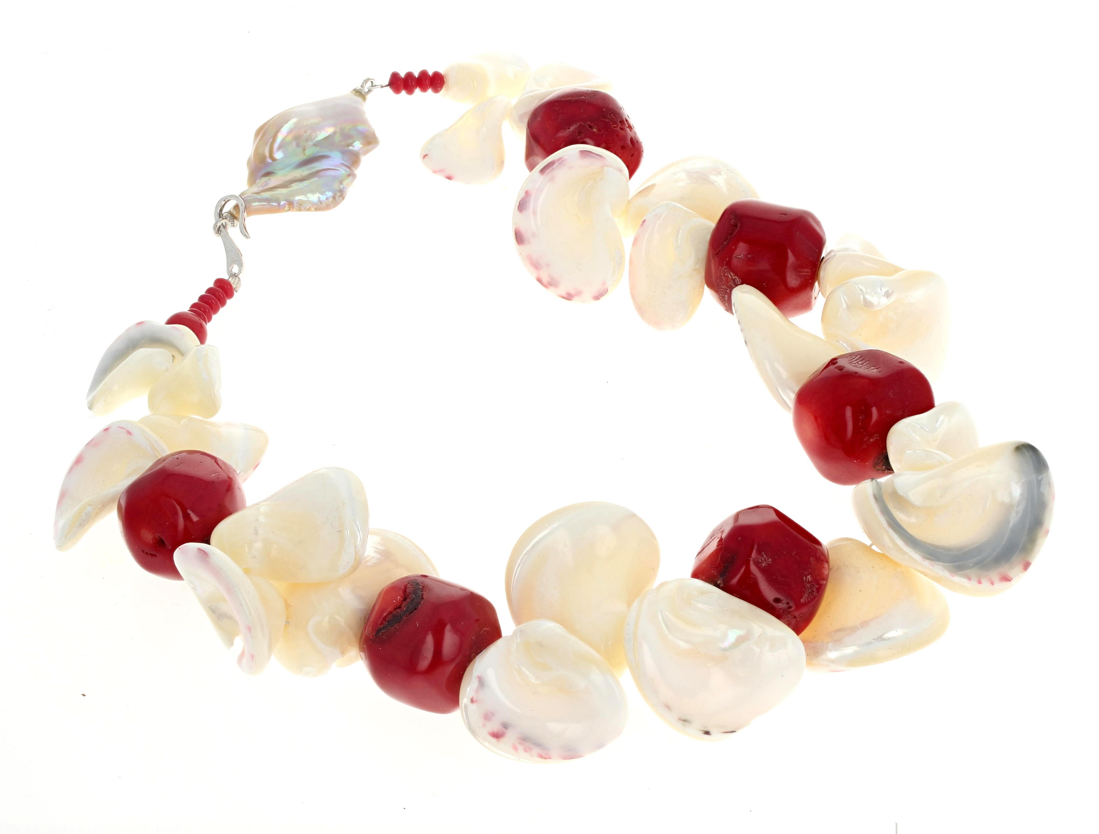 This gorgeous statement necklace of real natural polished Pearl shells and real natural red Coral is 17 inches long.  The big beautiful red coral are approximately 23mm.  The fascinating Pearl shells are all different sizes but the largest is
