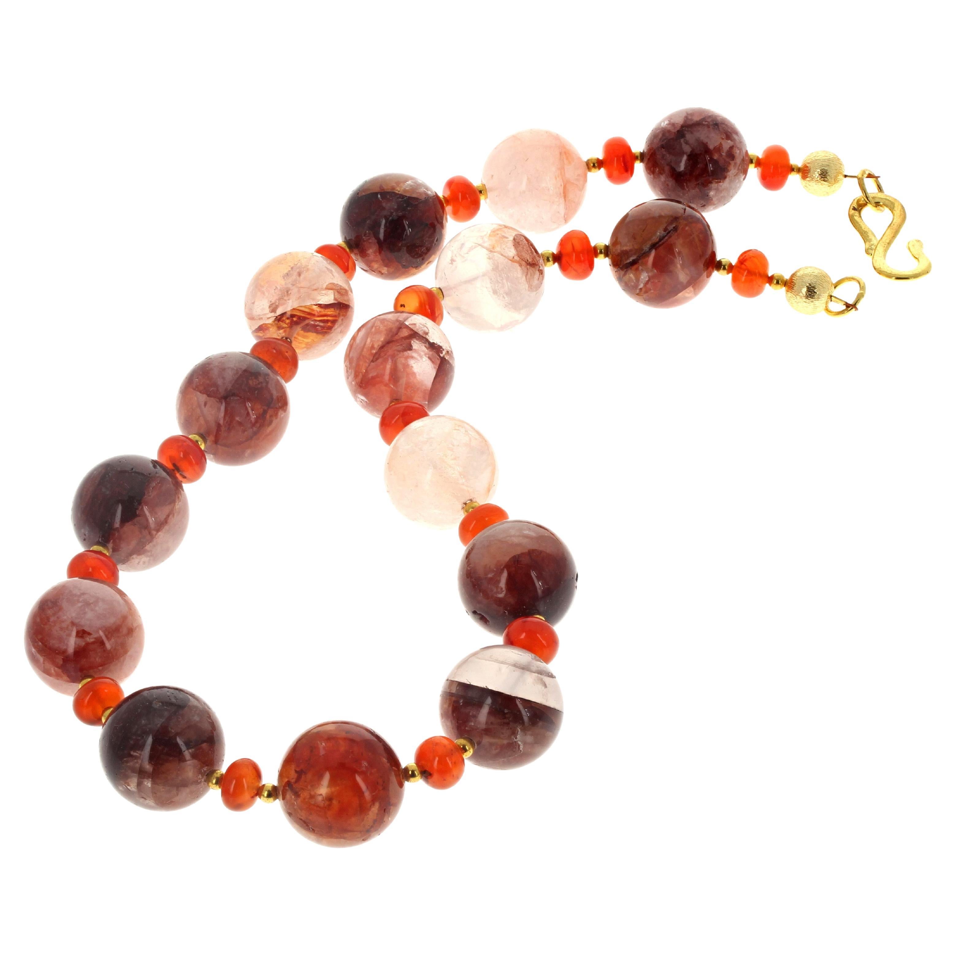 This lovely 19 inch long necklace is composed of highly polished translucent glowing natural real Strawberry Quartz (approximately 18mm) enhanced with highly polished glowing natural real Carnelian rondels (approximately 8mm) and little goldy