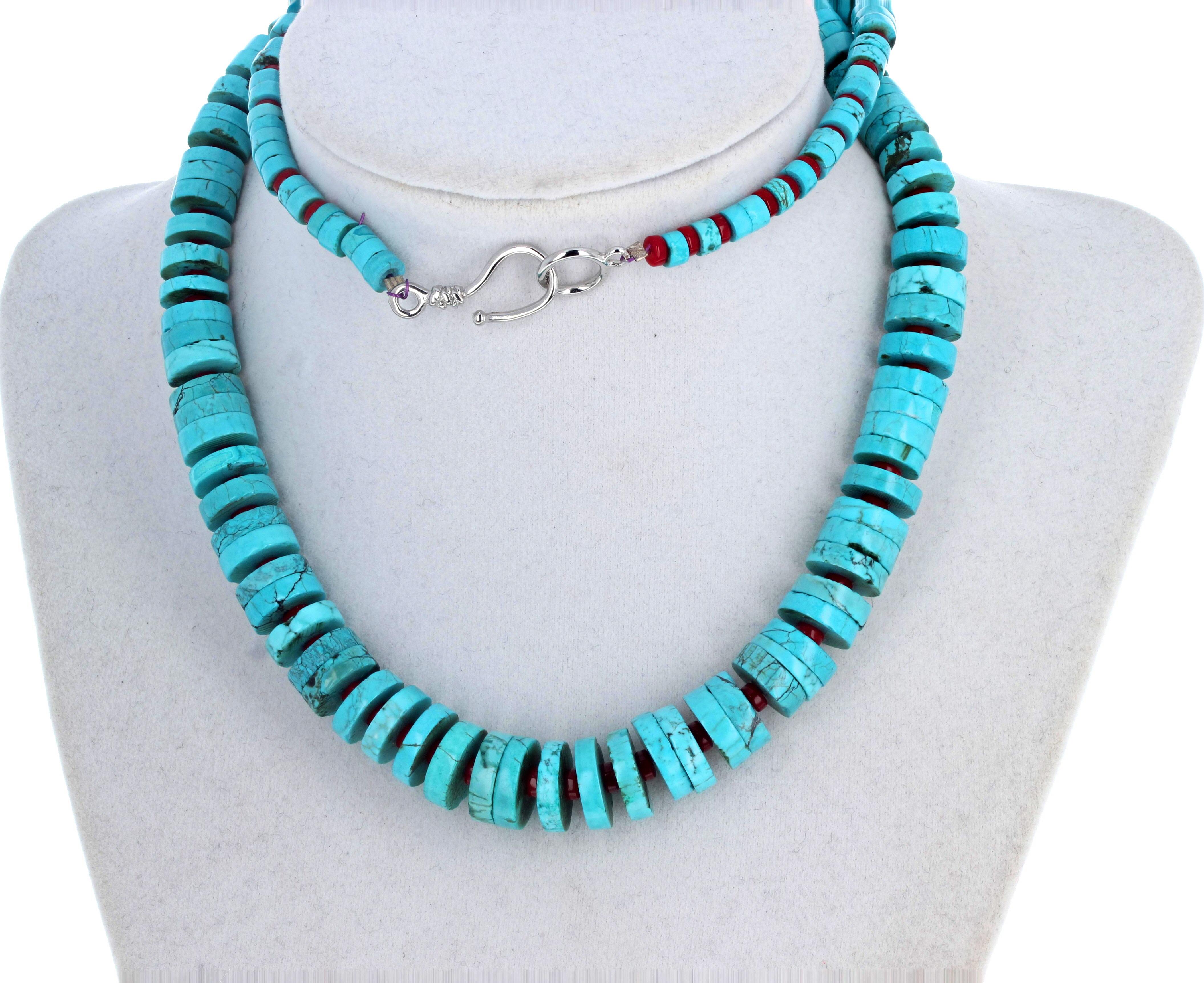 This lovely graduated highly polished slices of natural Turquois necklace enhanced with natural red Coral is 25 inches long.  The largest Coral are approximately 13mm and the clasp is silver.  