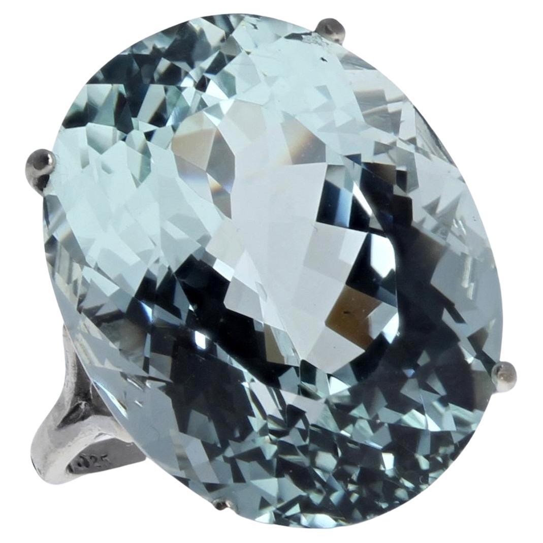 This gorgeous ring is natural Aquamarine measuring 21.4 mm x 17 mm and is 25.3 carats.  There are NO EYE VISIBLE inclusions in this magnificent simply set gemstone.  This is set in Sterling Silver.  
