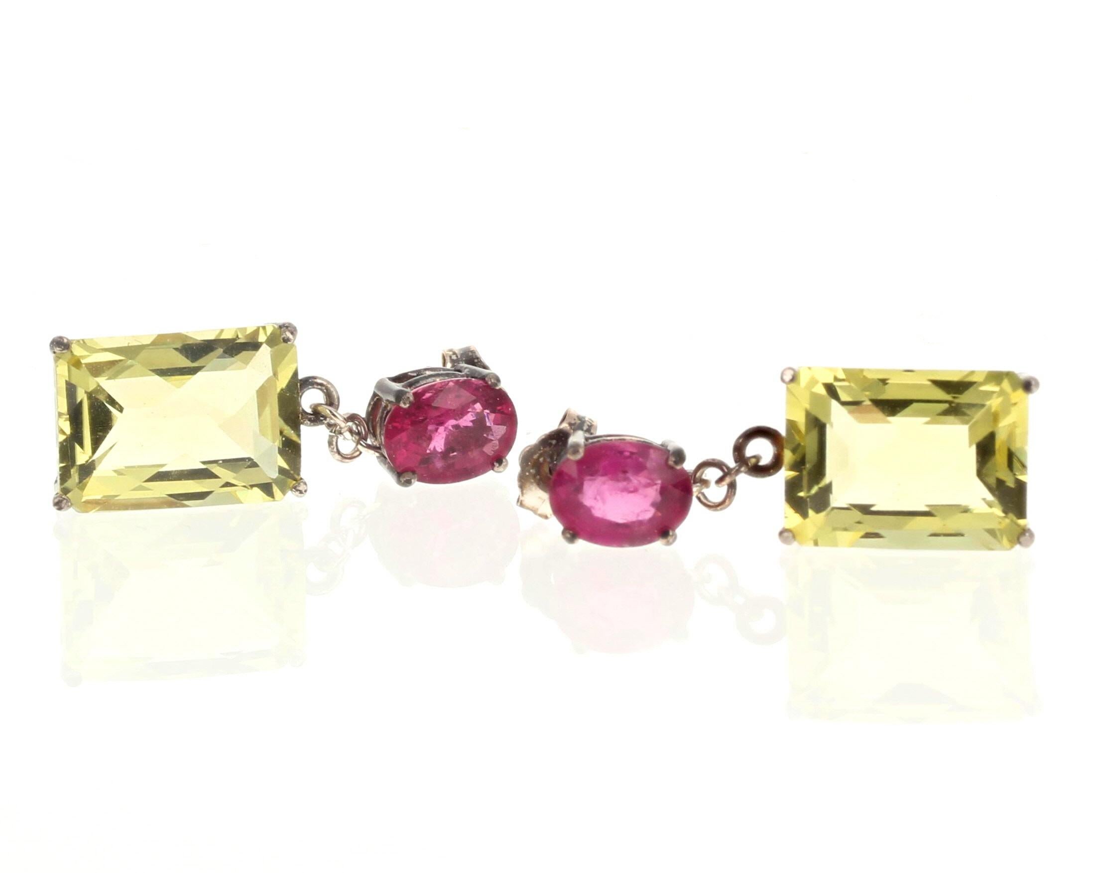 These fun pretty glittering earrings hang approximately 28mm long on their sterling silver studs.  The Tourmalines total approximately 2.5 carats (7 1/2mm x 5mm) and the brilliant yellowy natural Lemon Quartz (14mm x 10mm) total approximately 10