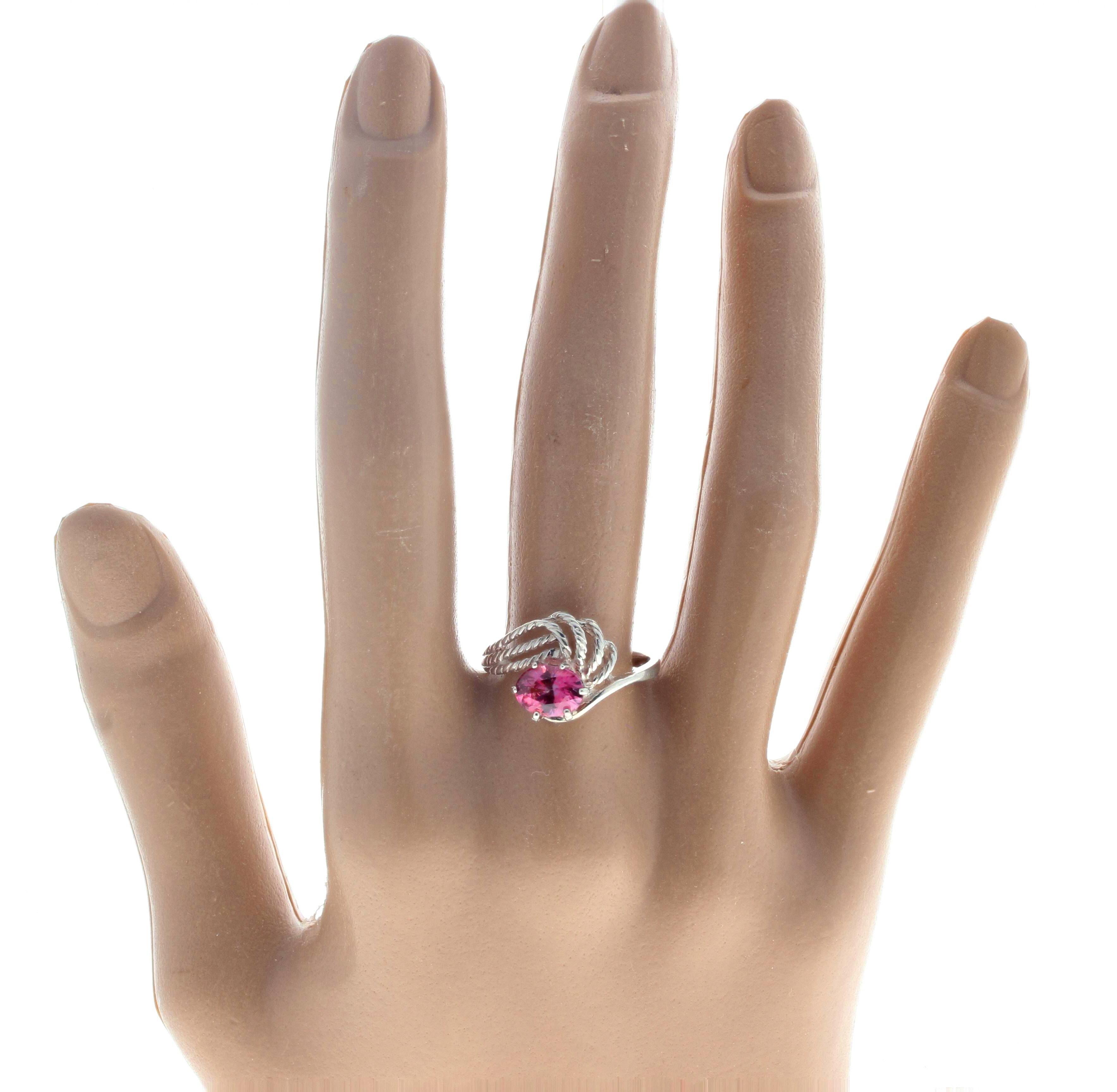 This is a two-tone pink and pinky-red glittering 1.43 Carat Spinel set in our unique handmade artistically designed sterling silver ring sizable 8.25.  