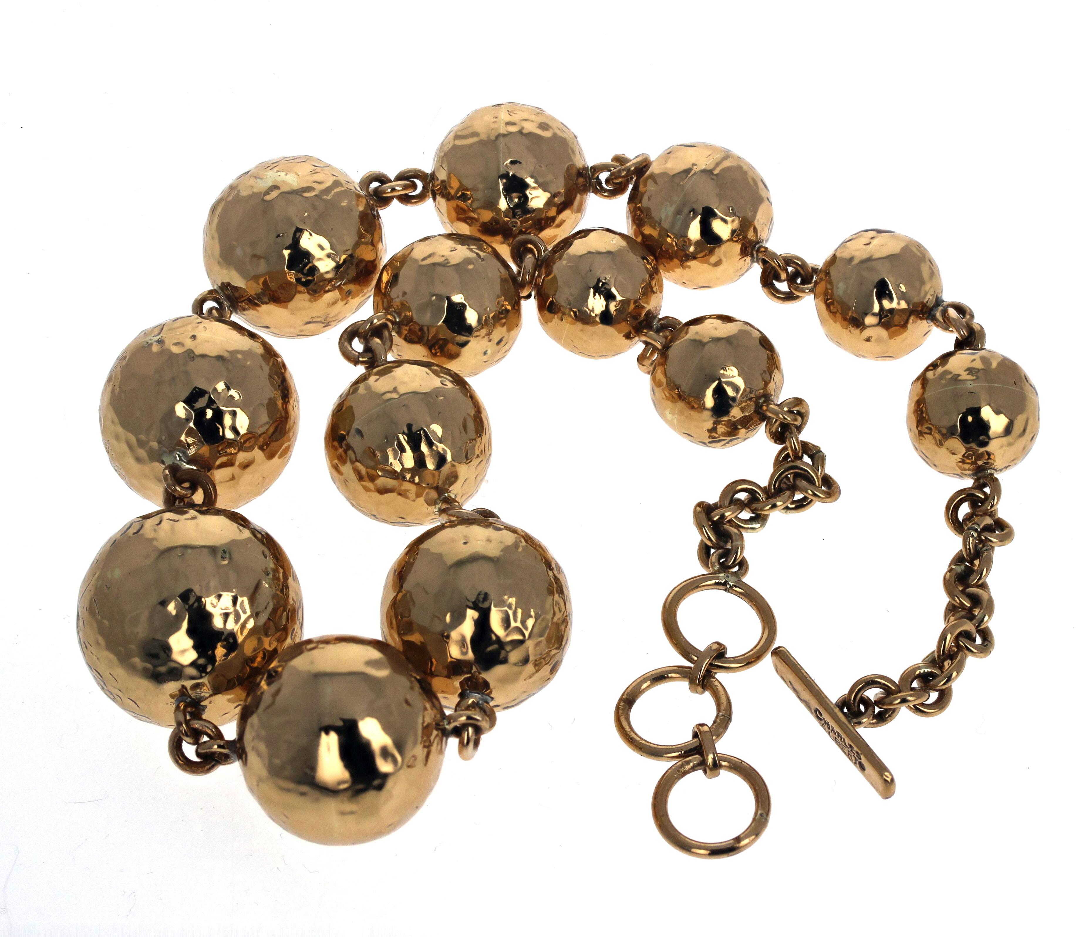Absolutely fascinating Statement gold plated rondel necklace.  The largest center rondel is 28mm.  The clasp is an easy to use hook clasp with extra loops on it so that you can set it around your neck in lengths from 18 inches to 20 inches.  The