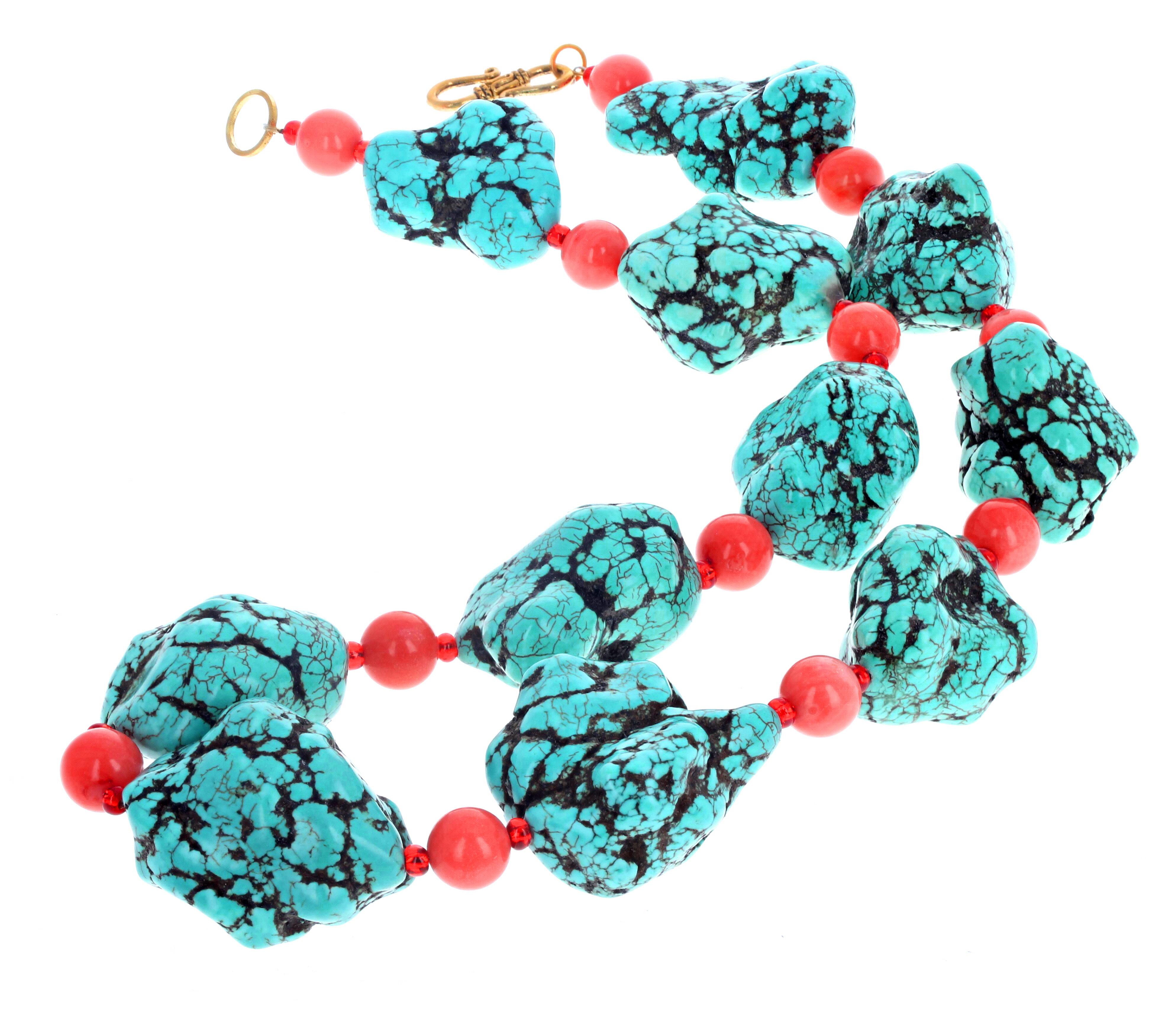 These enormous polished chunks of Turquoise are enhanced with highly polished orange Carnelians to complete this fascinating 21 1/2 inch long necklace.  The largest Turquoise is 36mm x 28mm and the clasp is a gold plated hook clasp.  