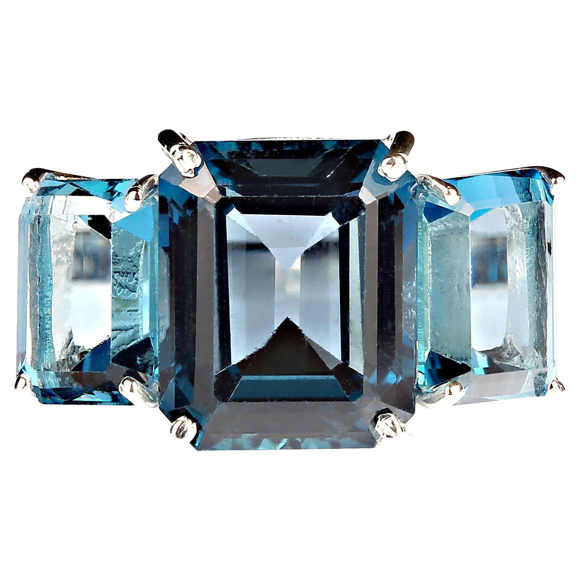 Classic Ring of London Blue Topaz.  This elegant three stone ring features three London Blue in emerald cut for a total weight of 14.84 carats.  Custom setting of sterling silver.  Wear this gorgeous ring morning right through the day and through