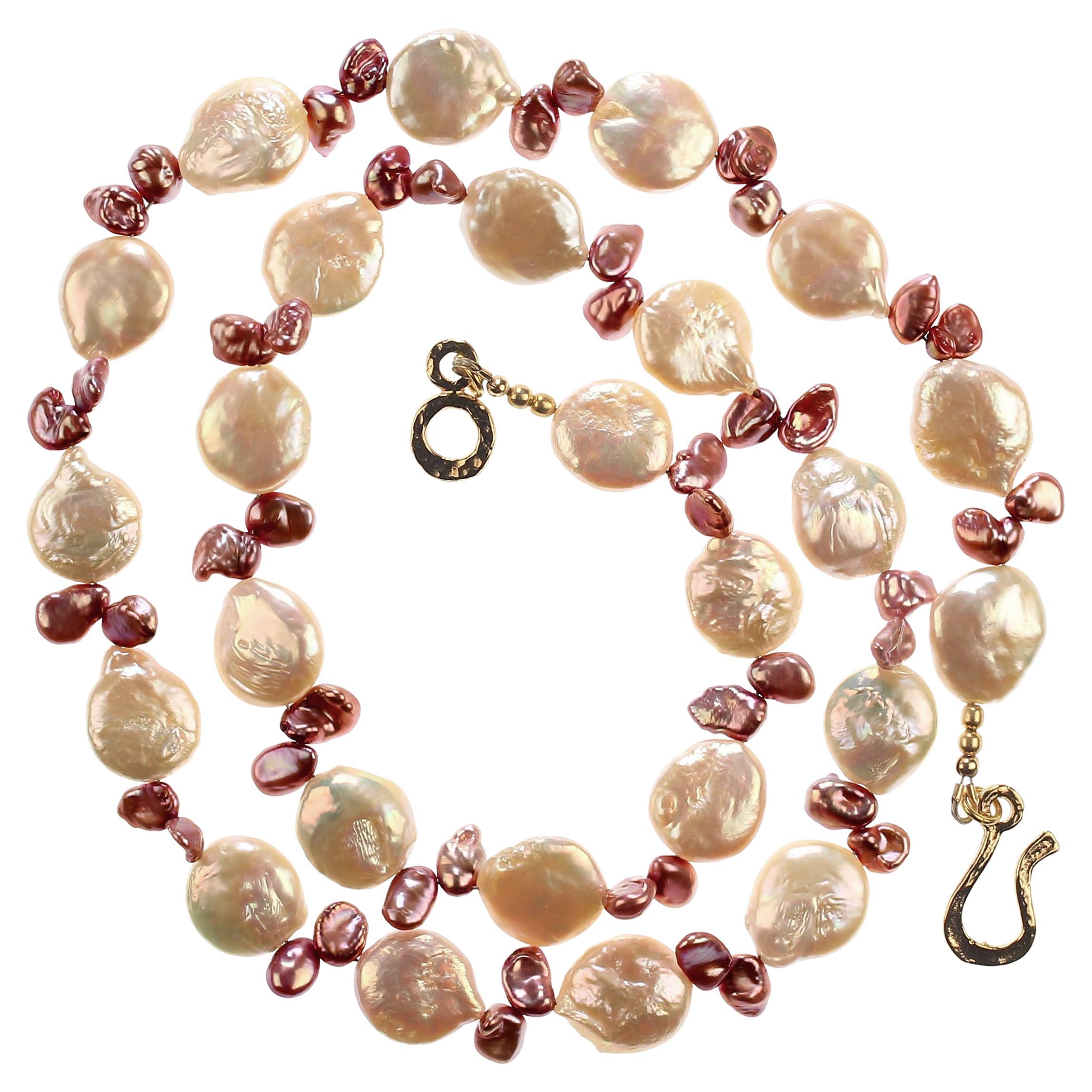 'Pearls are always appropriate' Jackie Kennedy

Unique, handmade necklace of 13-14 MM peachy toned and mauve briolette pearls. This elegant, one of a kind necklace features iridescent peach tone Coin Pearls accented with the smaller mauve pearls.