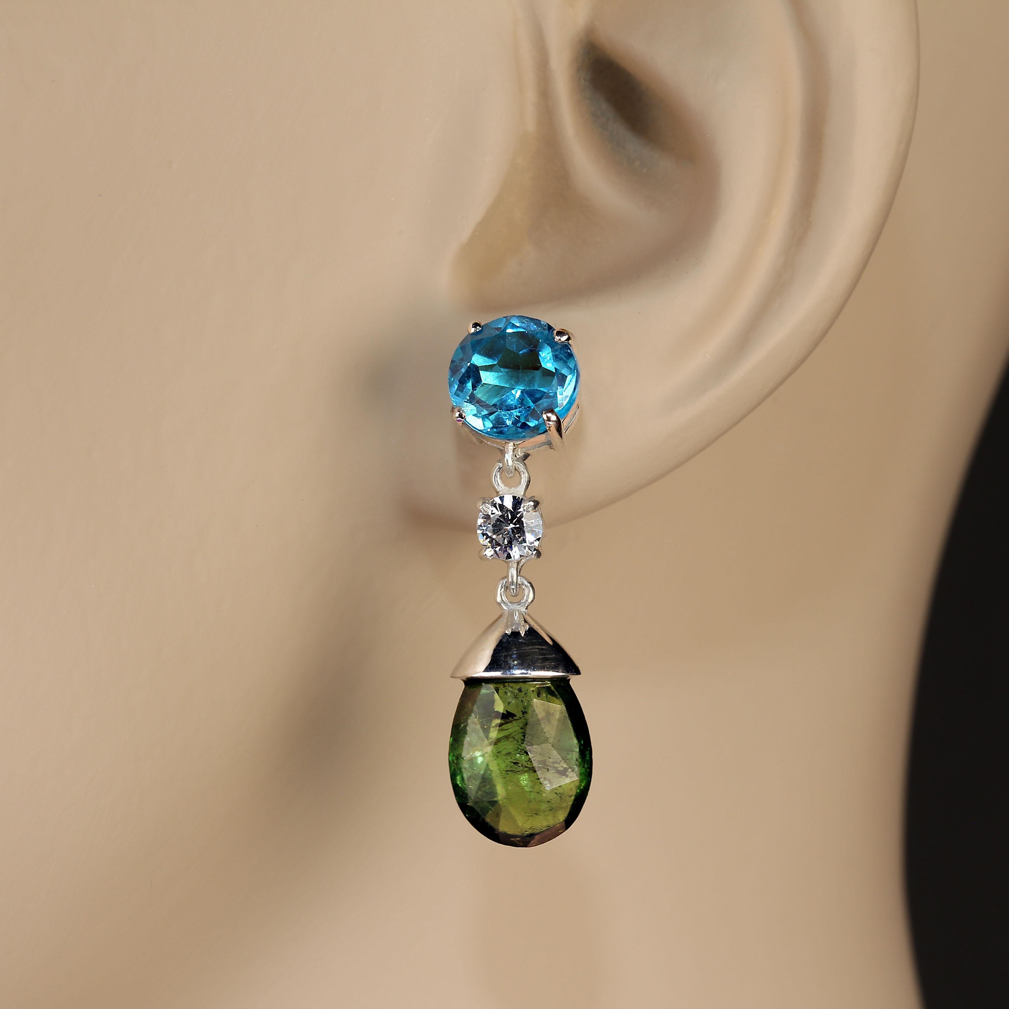 1.25 Inches of dangle and swing in these sparkling earrings of bright blue Apatite and deep green Tourmaline.  The round Apatite weigh total 2.94ct. The faceted briolette Tourmaline weigh total 4.78ct. The genuine zircons weigh total 0.85ct. These