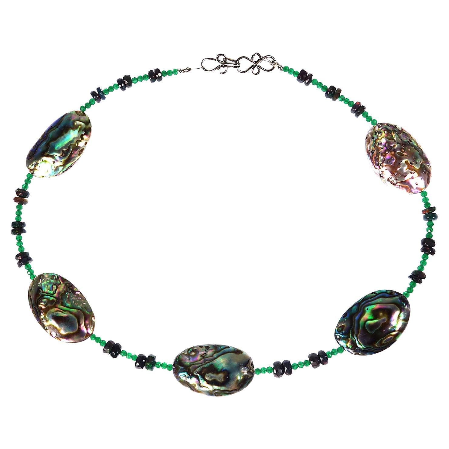 Unique choker length necklace that is perfect for Spring and Summer.  This delicate necklace features five stations of Paua Shell, 27x18 MM, alternating with Black Opal rondels and green quartz.  There are lovely flashes of red in the Black Opal. 