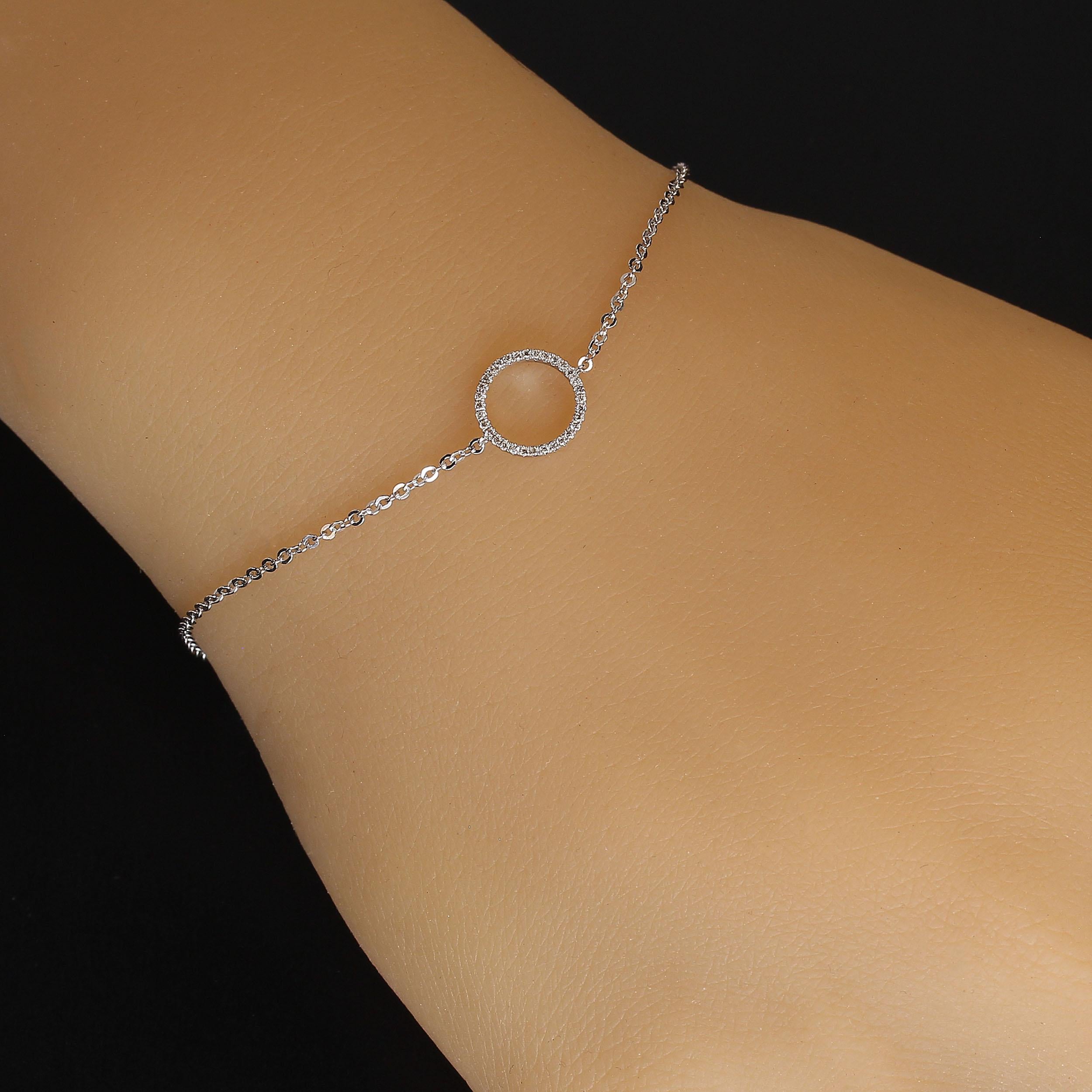 Diamond Circle Bracelet or Ankle Bracelet in 7 inch elegant 14K white gold to grace your wrist. The diamond circle features 0.07cts of sparkling diamonds. This lovely bracelet also has stations at 6 and 6.5 inches in the chain which is flashly and
