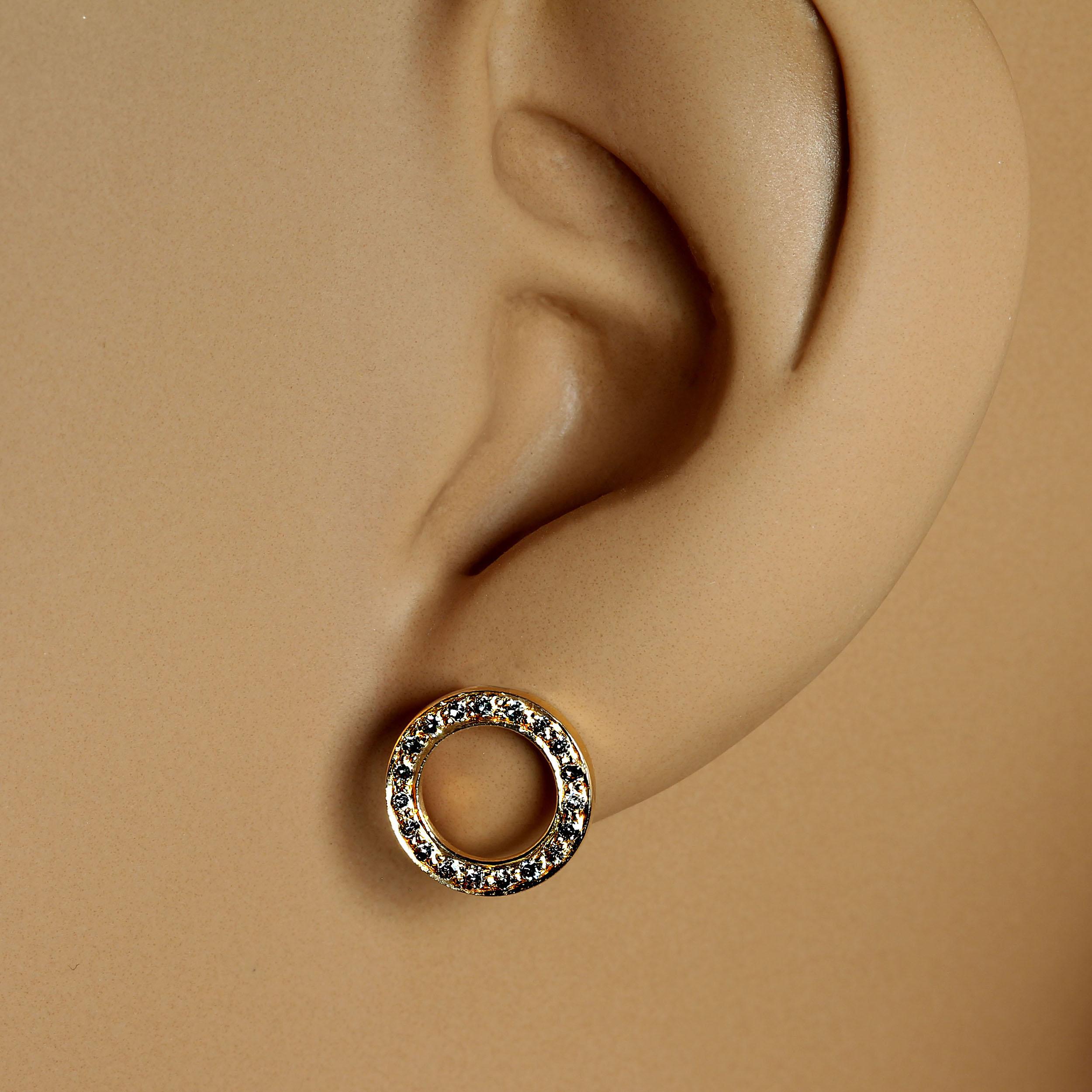 Delicate Diamond and 14KT rich yellow gold circle earrings that lie flat against the ear.  These delightful earrings feature 0.21 carats of diamonds and 1.614 grams of 14KT gold. These earrings are perfect for anyone who's piercings are not quite