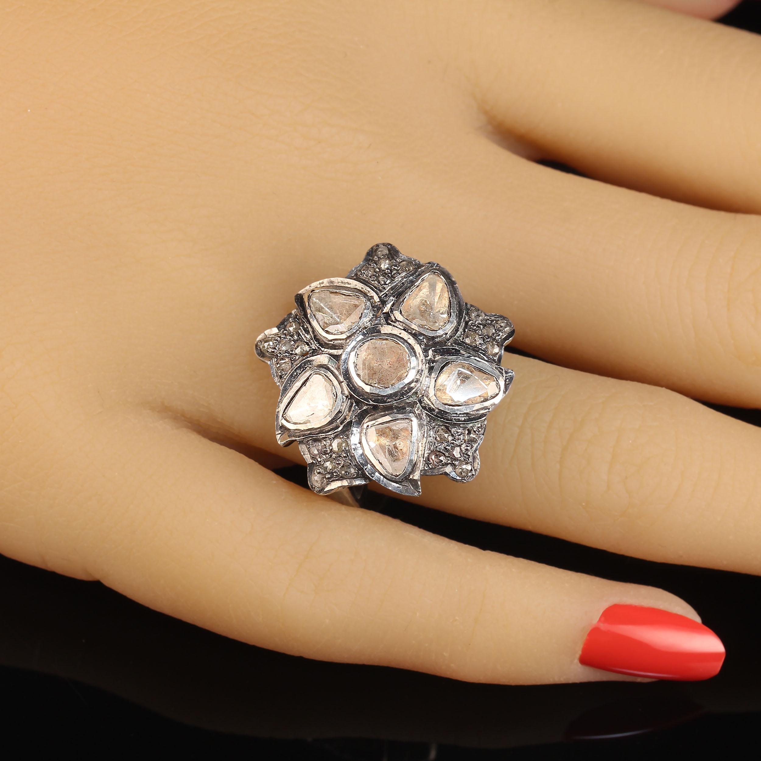 Elegant flower design of diamond slices and chips on antiqued sterling silver.  This beauty is 23 x23 MM wide and a size 7.  No changes by seller.